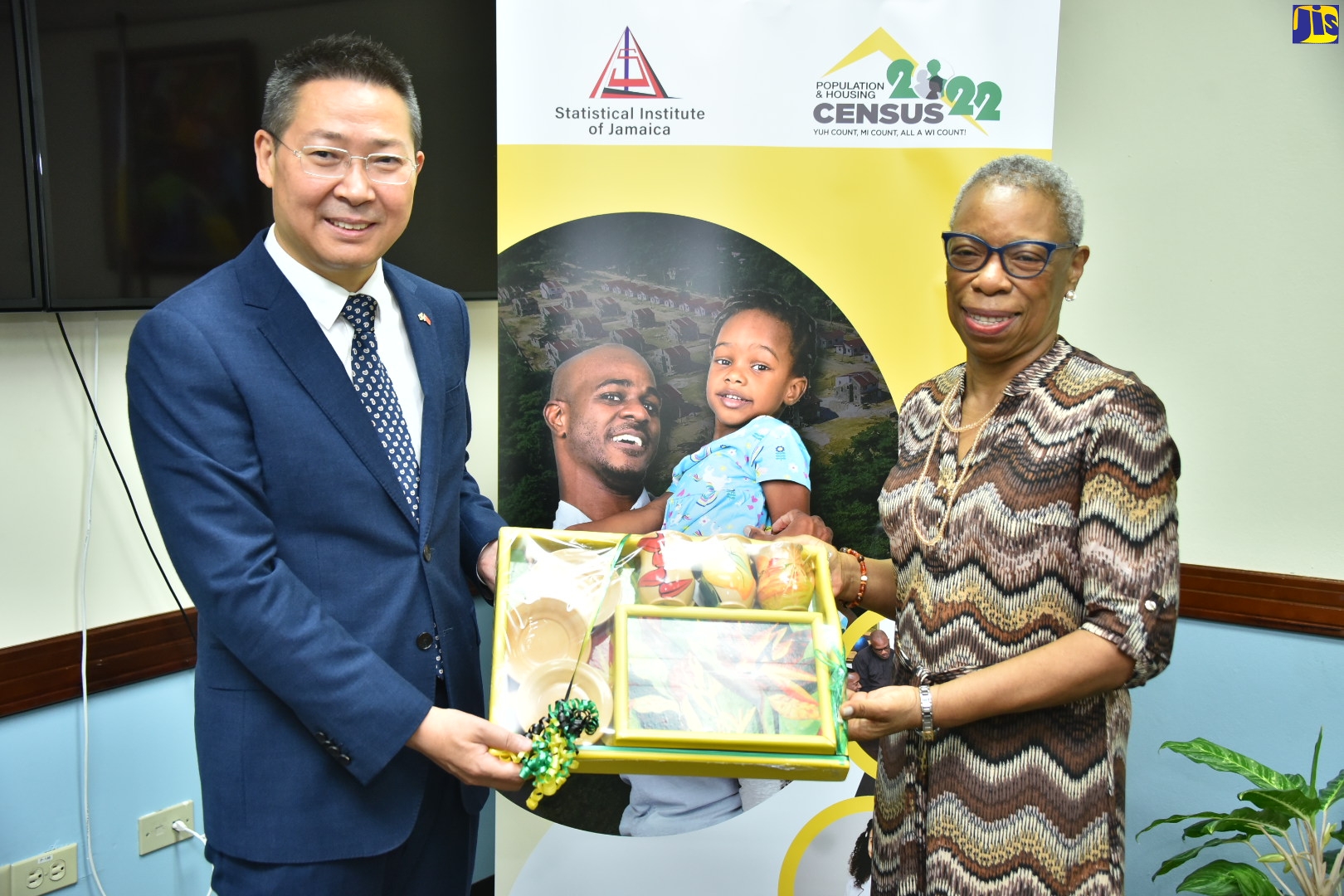 Director General, Statistical Institute of Jamaica (STATIN), Carol Coy, presents a gift to Ambassador of the People’s Republic of China to Jamaica, His Excellency Chen Daojiang during a courtesy call paid on her at the offices of the Statistical Institute of Jamaica on September 14.