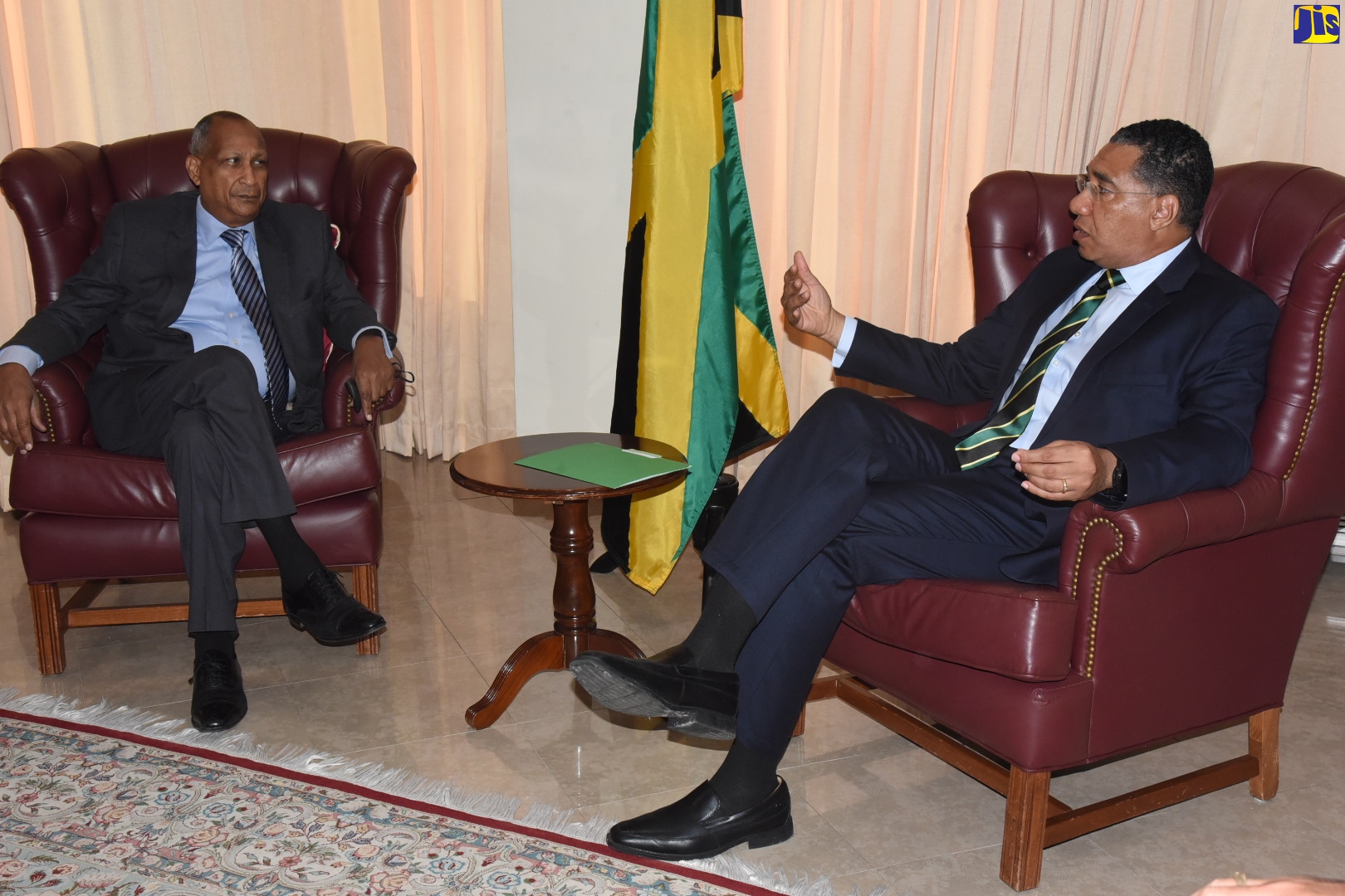 Prime Minister, the Most. Hon. Andrew Holness (right), makes a point to Howard Shearer, son of late Jamaican Prime Minister, the Most Hon. Hugh Shearer, during a courtesy call at the Office of the Prime Minister on September 12.