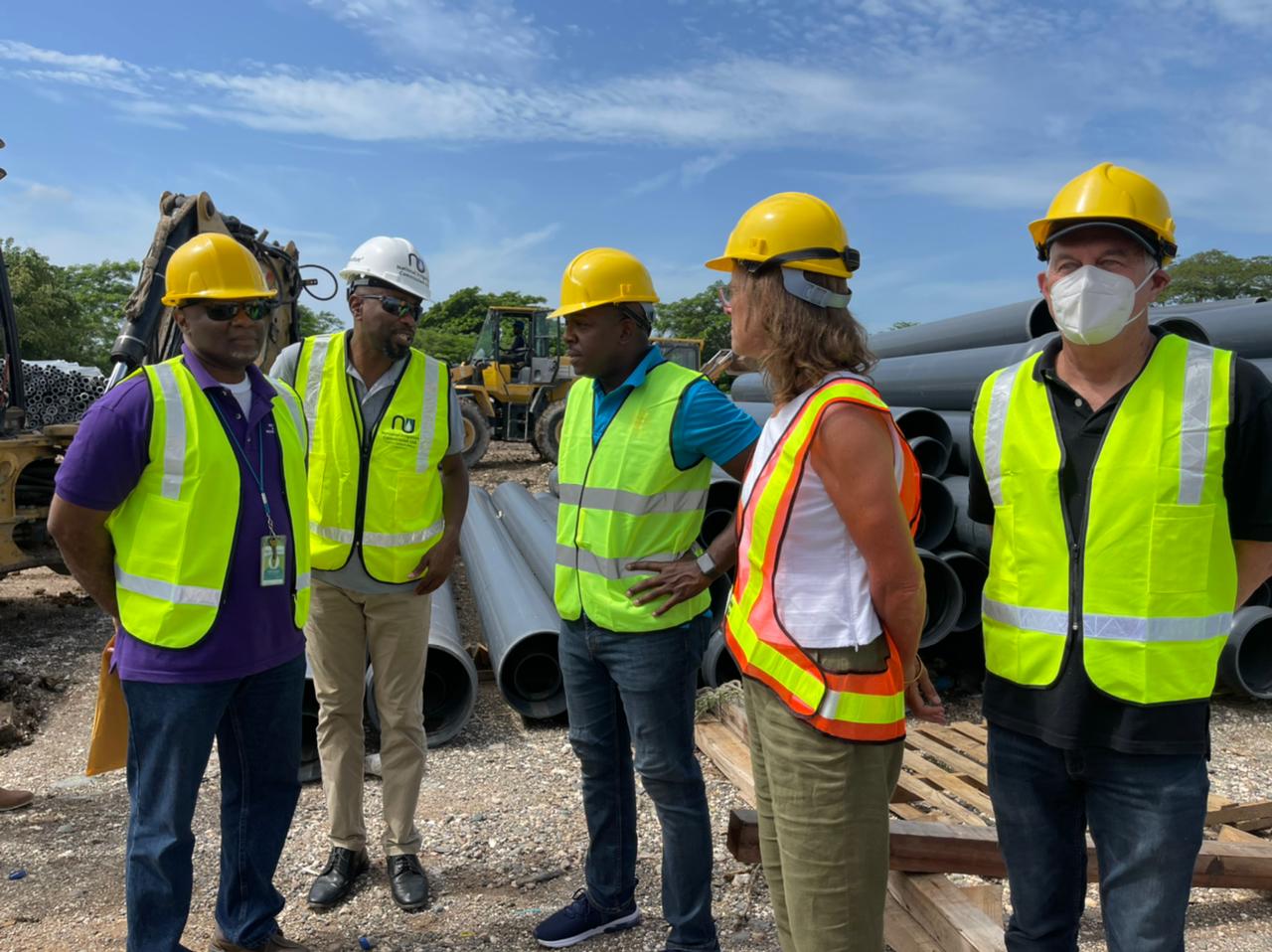 Minister of Agriculture and Fisheries, Hon. Pearnel Charles Jr. (centre), converses with (from left) Project Manager, Southern Plains Agricultural Development (SPAD) Project, Wayne Williams; Chief Executive Officer, National Irrigation Commission, Joseph Gyles; British High Commissioner to Jamaica, Her Excellency Judith Slater, and Caribbean Development Bank (CDB) Representative, Andrew Dupigny, during a tour of the Amity Hall worksite in St. Catherine on Thursday (September 1).