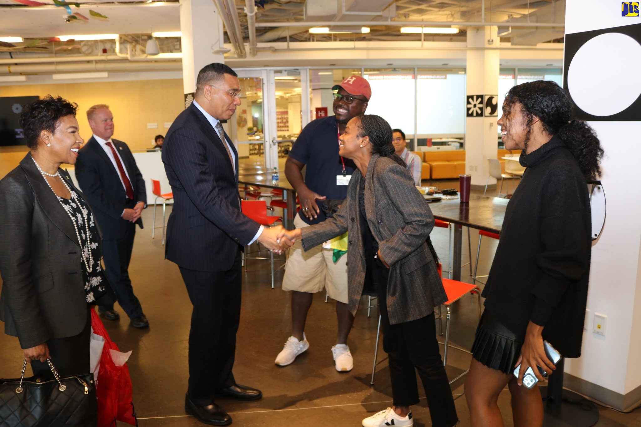 Prime Minister, the Most Hon. Andrew Holness (third left) greets Jamaican student at Harvard University, Kristina Brown (second right), during a visit to the institution in Cambridge, Massachusetts on Thursday (September 15). Looking on are Jamaican students Matthew Davis (fourth left) and Bianca Polycarpe (right). Sharing the moment at left is Jamaica’s Ambassador to the United States, Audrey Marks. The Prime Minister visited the university to speak at a roundtable on ‘Reimagining the Role of Business in the Public Square.’