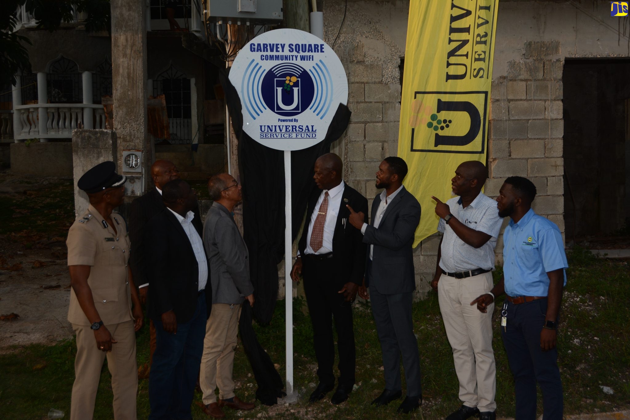Deputy Prime Minister and Minister of National Security, Hon. Dr. Horace Chang (third left), unveils the sign for the official launch of the Universal Service Fund (USF) free community Wi-Fi hotspot at Garvey Square in Norwood on September 21.  He is joined by Deputy Mayor of Montego Bay, Councillor Richard Vernon (third right), USF’s Chief Executive Officer, Daniel Dawes (fourth right), and other stakeholders.