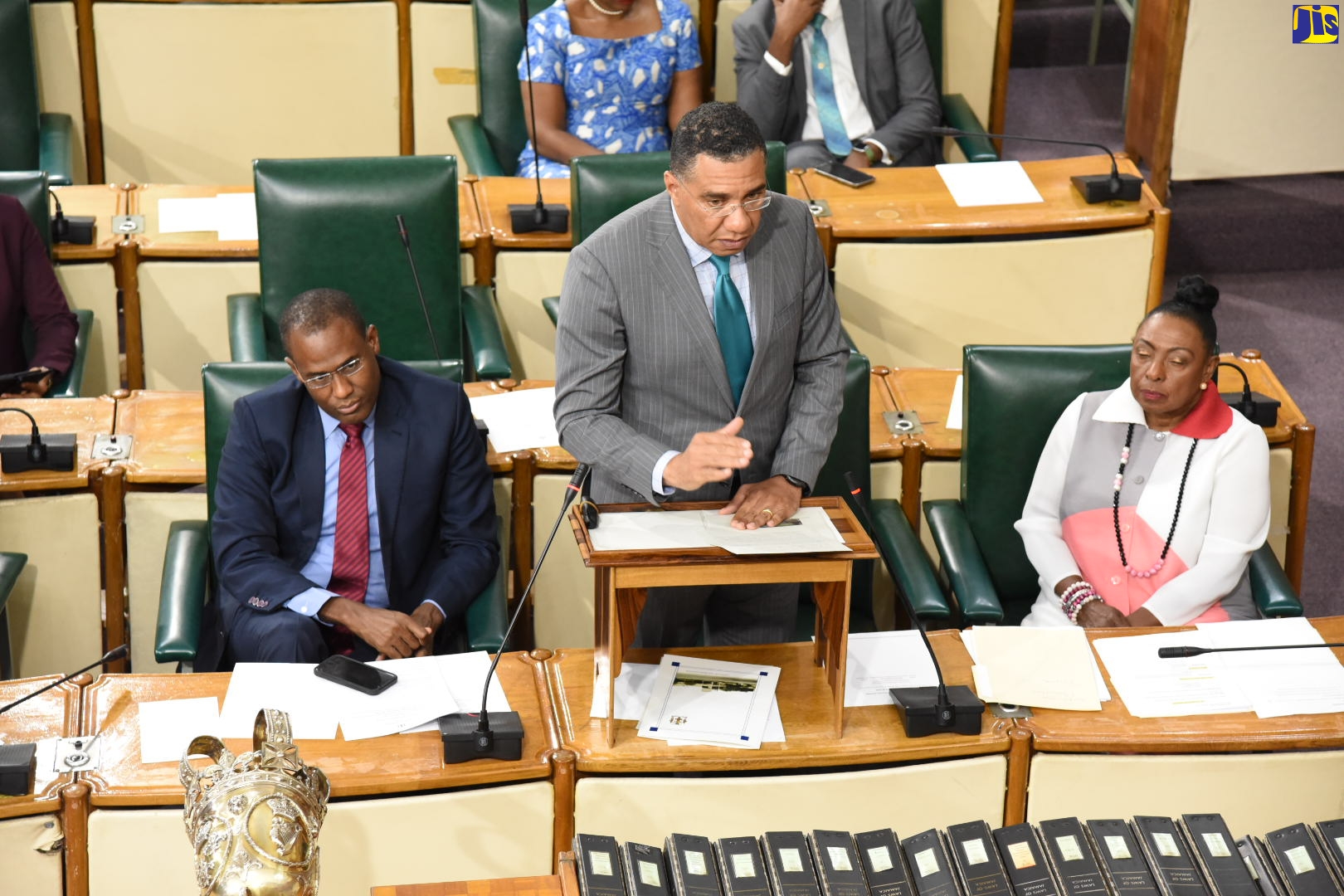 Prime Minister, the Most Hon. Andrew Holness, makes a statement to the House of Representatives on Wednesday (September 28). Listening (from left) are Minister of Finance and the Public Service, Dr. the Hon. Nigel Clarke, and Minister of Culture, Gender, Entertainment and Sport, Hon. Olivia Grange. 