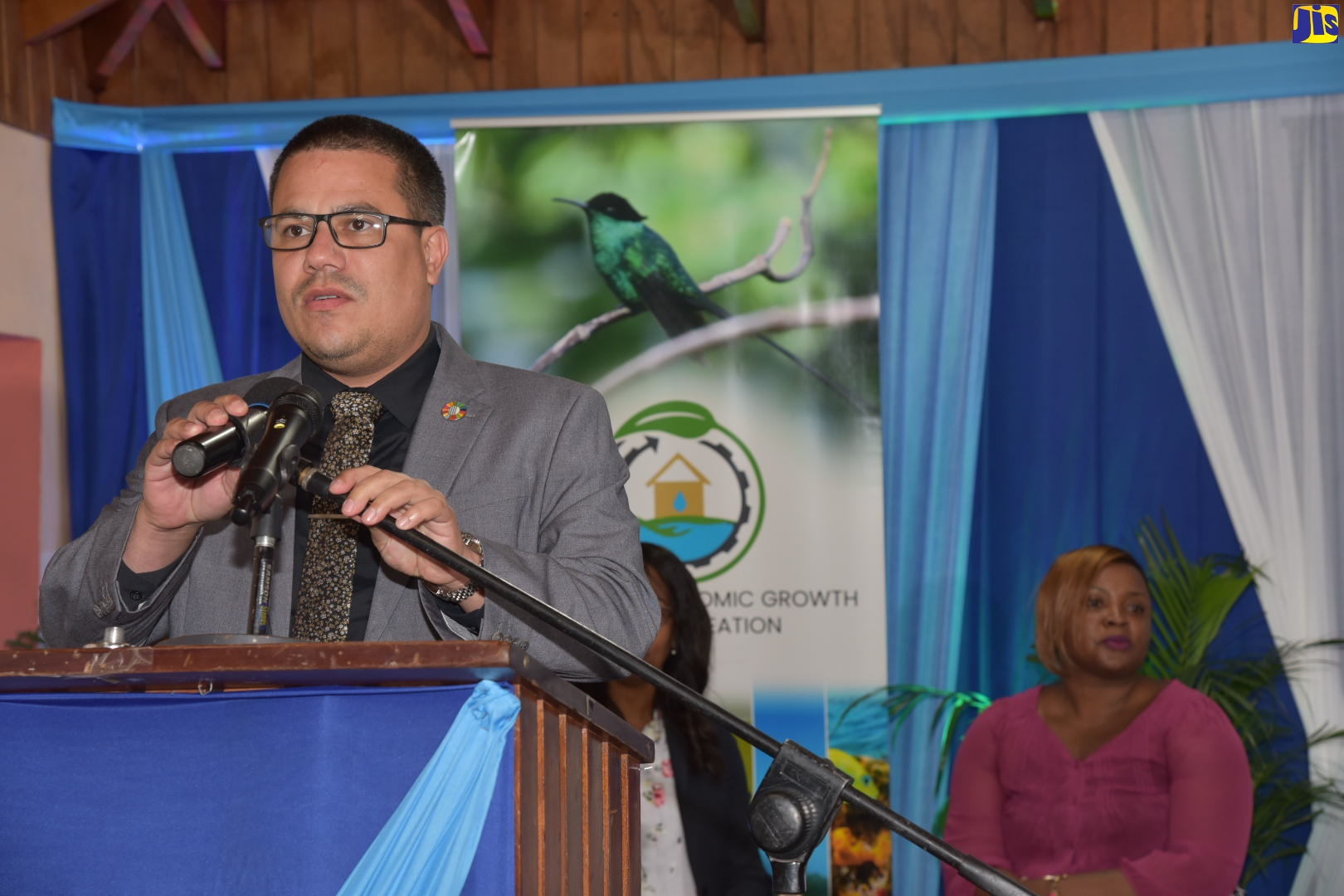 Minister without Portfolio in the Ministry of Economic Growth and Job Creation, Senator the Hon. Matthew Samuda, provides update on the management of plastics and the environment during a Plastics Forum, held virtually on August 30. Seated is Head of the Technical Regulations Unit in the Bureau of Standards Jamaica, Phillipa O’Conner Bennett.