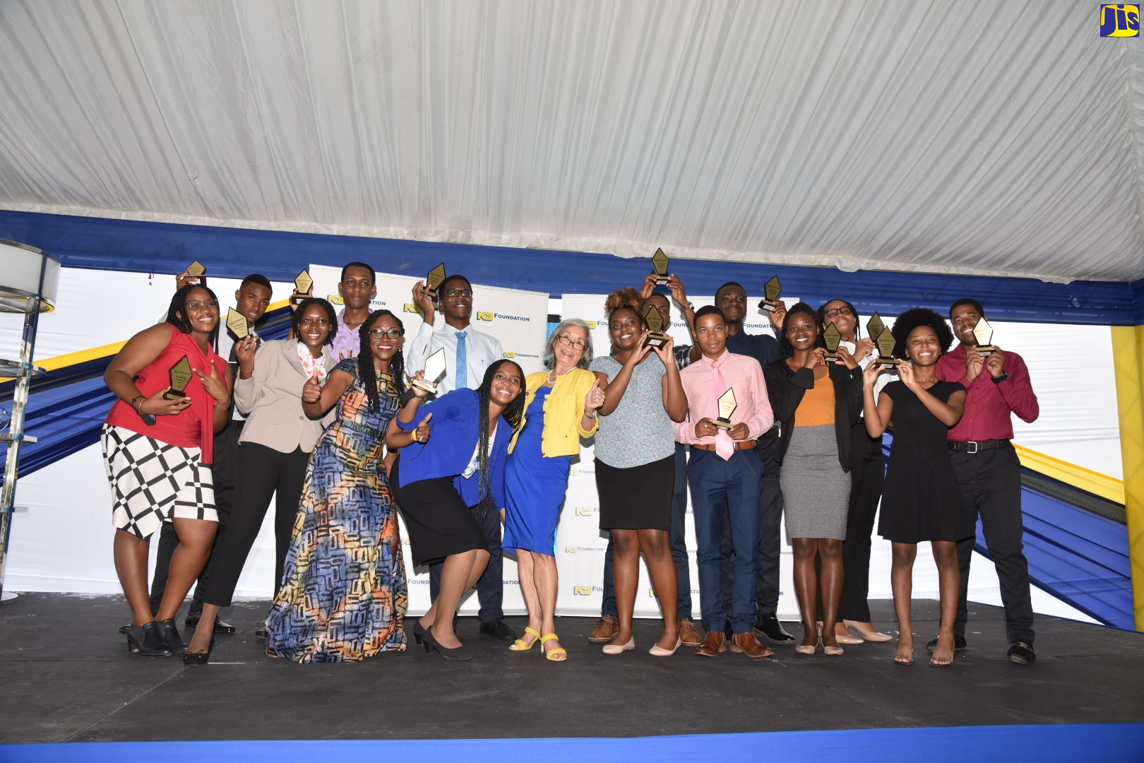 Recipients of the NCB Foundation 2022 Tertiary Scholarship and Grant Programme, with Chief Executive Officer of the NCB Foundation, Nadeen Matthews Blair (front, 3rd left) and Chair of the NCB Foundation, Thalia Lyn (centre ). The presentation ceremony was held on September 2, at the NCB Wellness and Recreation Centre.