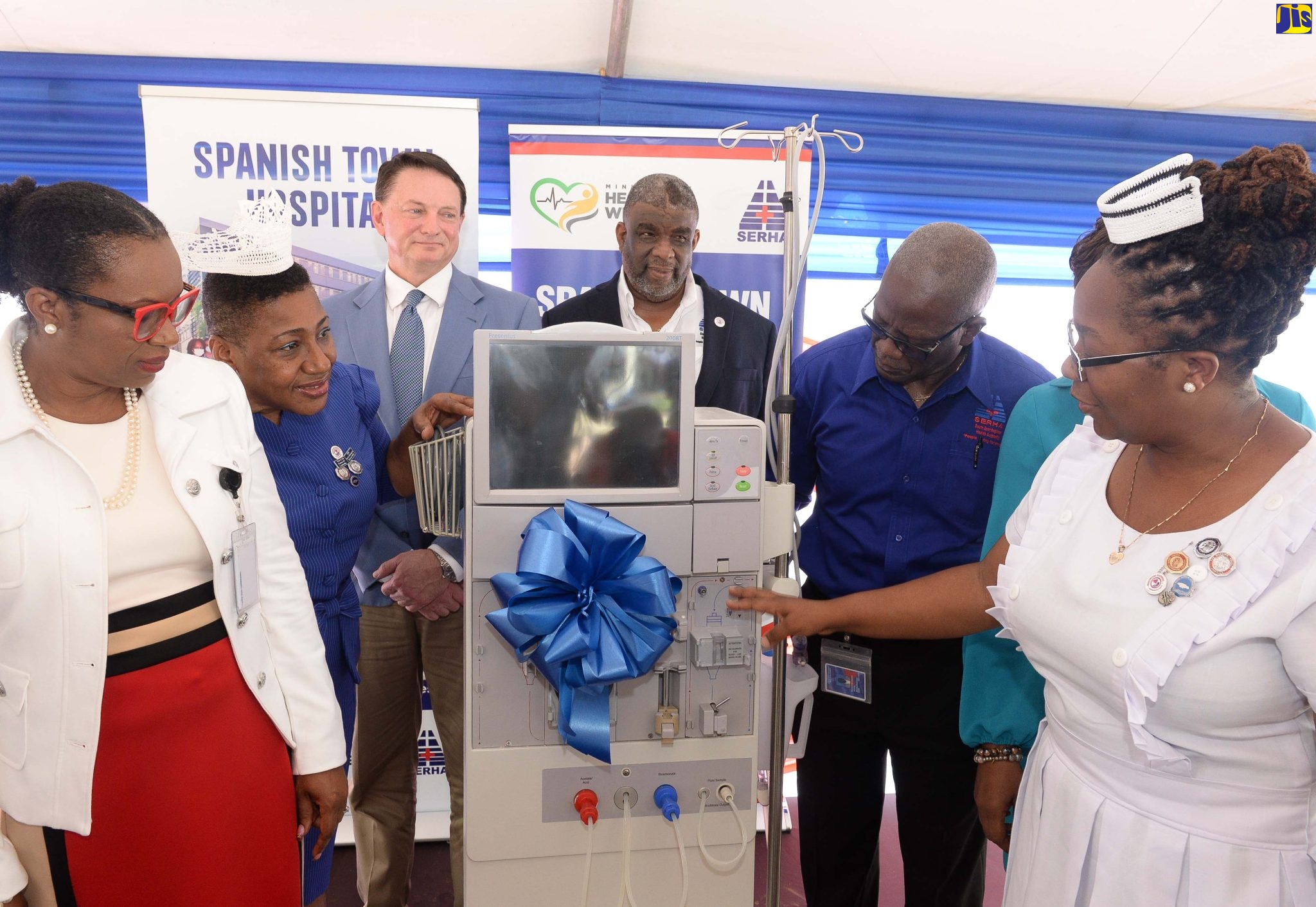 South East Regional Health Authority (SERHA) Chairman, Wentworth Charles (third right),  views one of the 10 refurbished hemodialysis machines valued over $28 million, that have bene donated to the Spanish Town Hospital by the Florida-based Renal Dynamics. Occasion was a ceremony at the hospital in St. Catherine, to hand over the machines on Monday (September 12). Others (from left) are the hospital’s Chief Executive Officer, Jacqueline Ellis; Director of Nursing, Novelette Robinson; Technical Services Manager, Renal Dynamics, Chris Davenport; Regional Director, SERHA, Errol Greene; Senior Medical Officer (SMO) at the hospital, Dr. Jacqueline Wright-James (partly hidden), and Acting Nursing Manager at the Dialysis Unit, Kaindece Barrett.