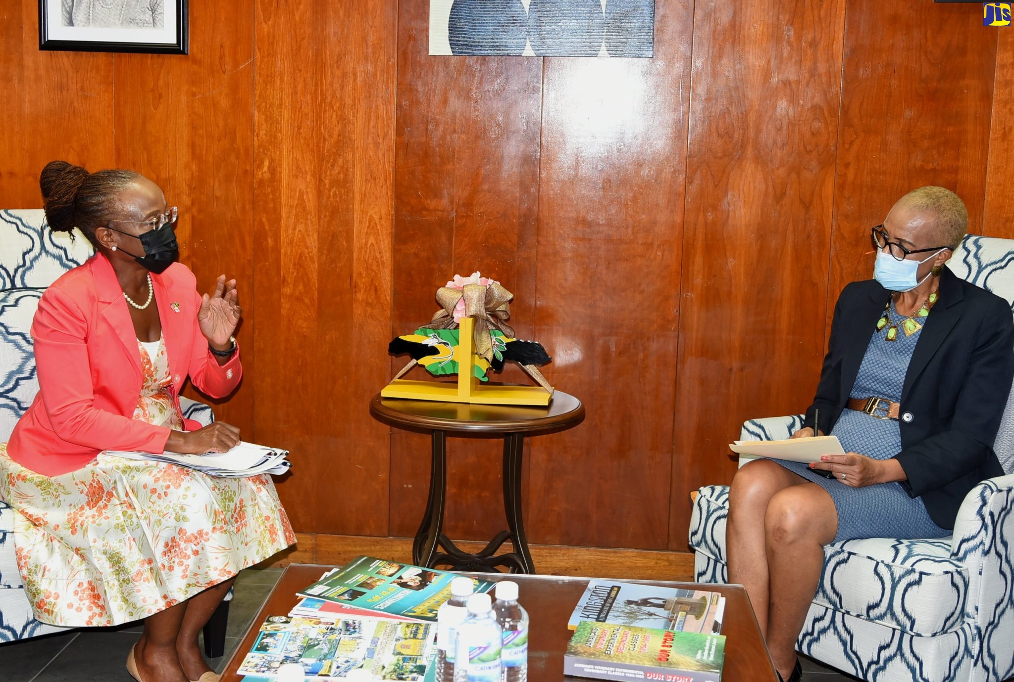 Minister of Education and Youth, Hon. Fayval Williams (right), converses with US Peace Corps Jamaica Country Director, Glenda Green, during a courtesy call to the Ministry’s Kingston offices on Wednesday (August 31).