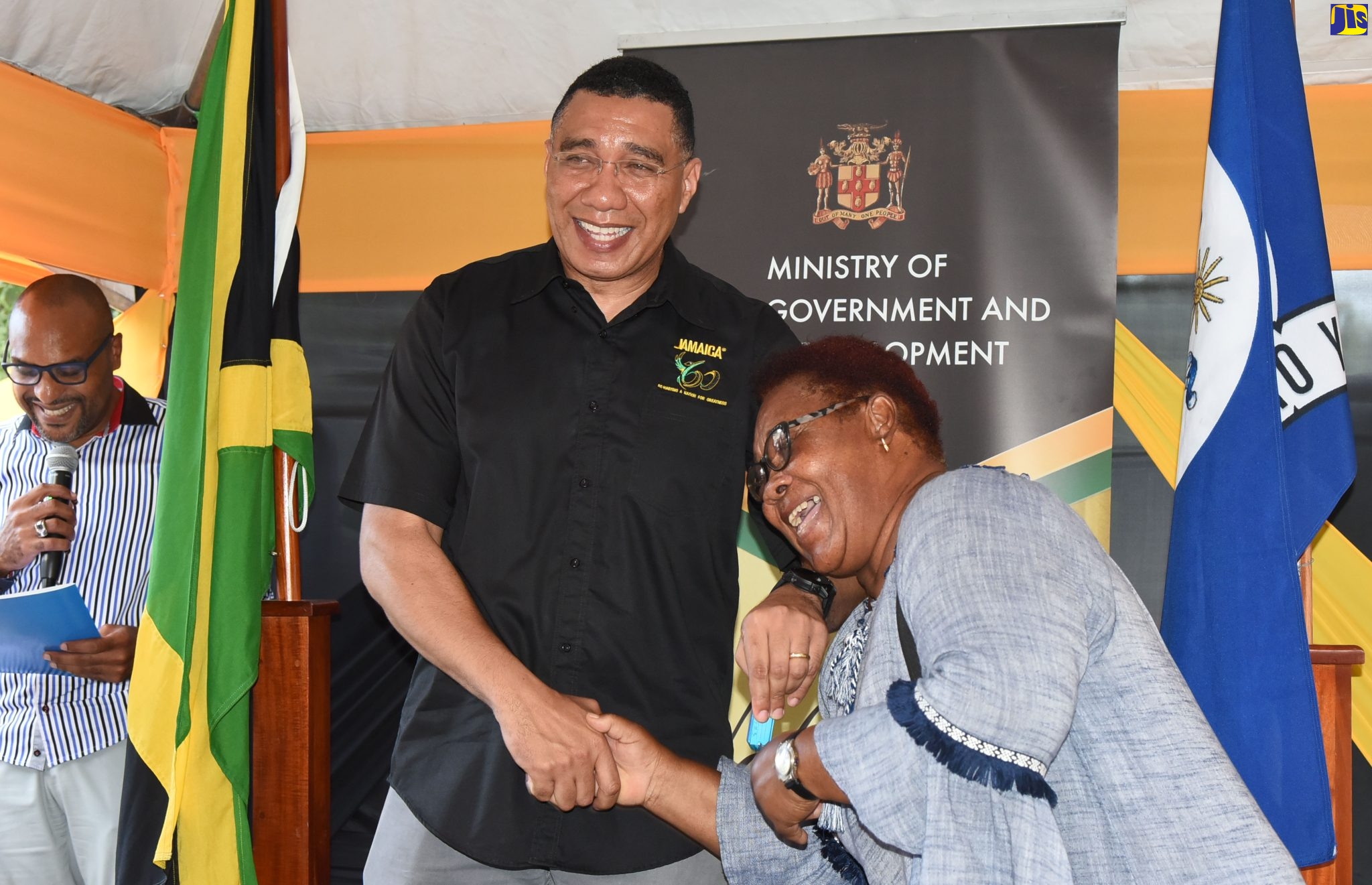 Prime Minister, the Most Hon. Andrew Holness, hands over the keys to one of the 12 units of a newly built apartment complex to beneficiary, Lucinda Ratigation, who lost her home to fire in November 2018. The complex is located on Fourth Street, Belrock, in Olympic Gardens, Kingston. The handover ceremony was held on Friday, September 23.

 