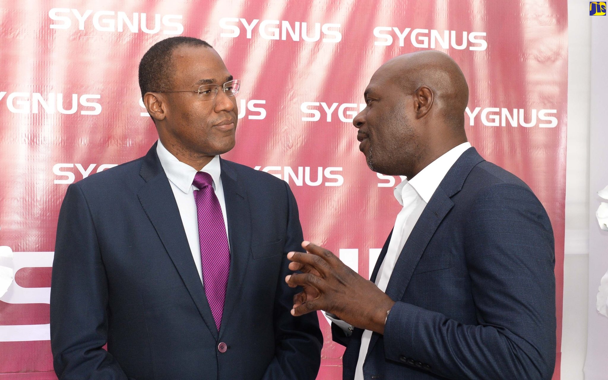 Minister of Finance and the Public Service, Dr. the Hon. Nigel Clarke (left), converses with Chief Executive Officer and President of Sygnus Capital, Beris Grey, during the inaugural ‘Sygnus Day’, held at the AC Hotel Kingston, on Thursday (September 22).