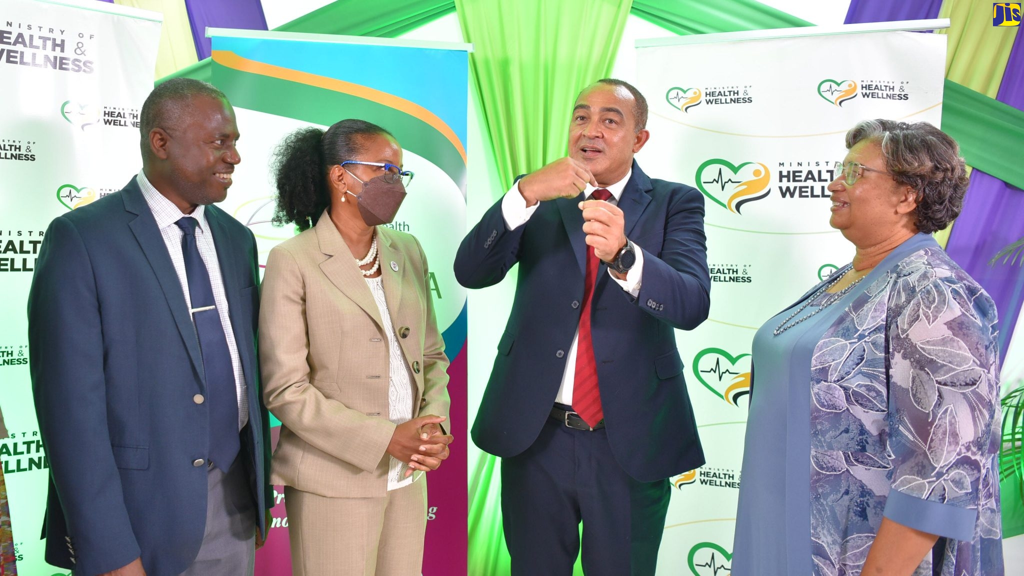 Minister of Health and Wellness, Dr. the Hon. Christopher Tufton (second right), makes a point while at the launch of the Caribbean Public Health Agency (CARPHA) 66th Health Research Conference, held at his New Kingston office on September 6. Listening (from left) are Director of Epidemiology and Internal Medicine at the Caribbean Institute for Health Research, Professor Trevor Ferguson; Acting Chief Medical Officer, Dr. Karen Webster Kerr, and Executive Director at CARPHA, Dr. Joy St. John.

