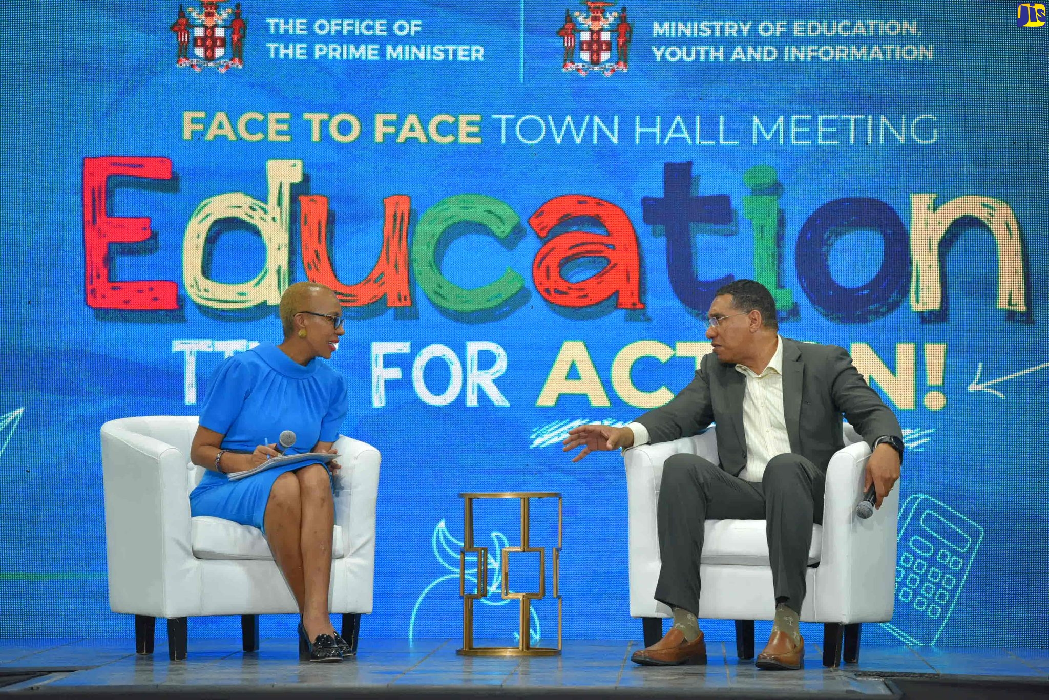 Prime Minister, the Most Hon. Andrew Holness (right), consults with Education and Youth Minister, Hon. Fayval Williams, during the question and answer session at Friday’s (September 9) town hall at Jamaica College, in St. Andrew. The meeting was organised by the Office of the Prime Minister (OPM).