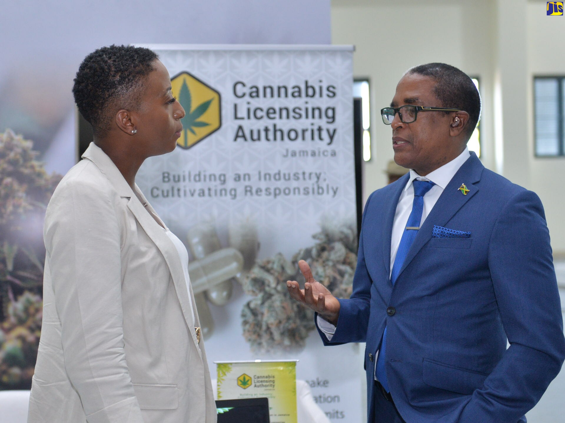 Minister of State in the Ministry of Industry, Investment and Commerce, Dr. the Hon. Norman Dunn, in discussion with Interim Chief Executive Officer, Cannabis Licensing Authority (CLA)t, Daenia Ashpole, during the CanEX Jamaica Conference and Business Expo at the Montego Bay Convention Centre in St. James, on September 16.