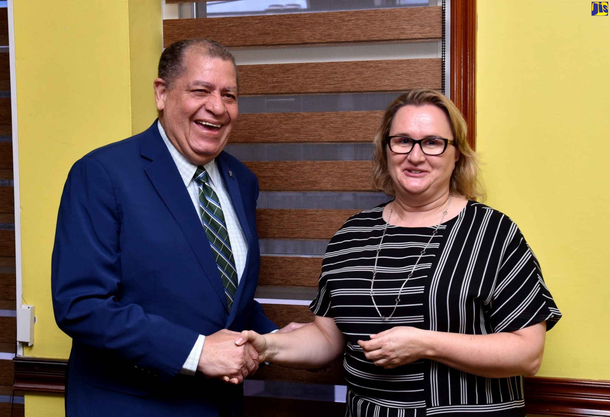Minister of Transport and Mining, Hon. Audley Shaw (left), shakes hands with Canadian High Commissioner to Jamaica, Her Excellency Emina Tudakovic, during a courtesy call at the Ministry’s offices in Kingston on Tuesday (September 13). 

