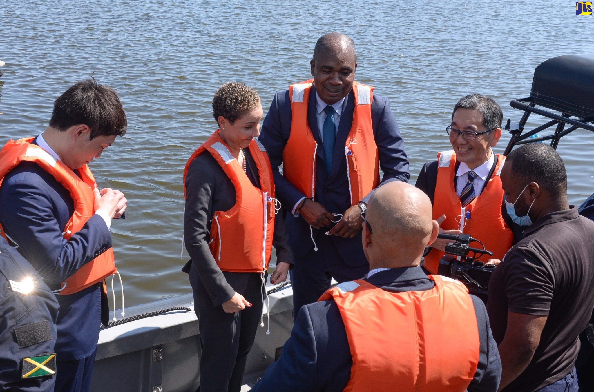 Minister of Foreign Affairs and Foreign Trade, Senator the Hon. Kamina Johnson Smith (second left), State Minister in the Ministry of National Security, Hon. Zavia Mayne (third left), and Japan’s Parliamentary Vice-Minister of Foreign Affairs Masatoshi Akimoto (left), prepare for a ride aboard the Rigid Hull Inflatable Boat, which has been donated to Jamaica under the Government of Japan’s Grant Aid Programme. Joining them are Ambassador of Japan to Jamaica, His Excellency Masaya Fujiwara (second right) and Police Commissioner, Major General Antony Anderson (foreground). The handover ceremony for the boat was held at the Jamaica Constabulary Force (JCF) Marine Headquarters in Kingston, on Wednesday (October 5).