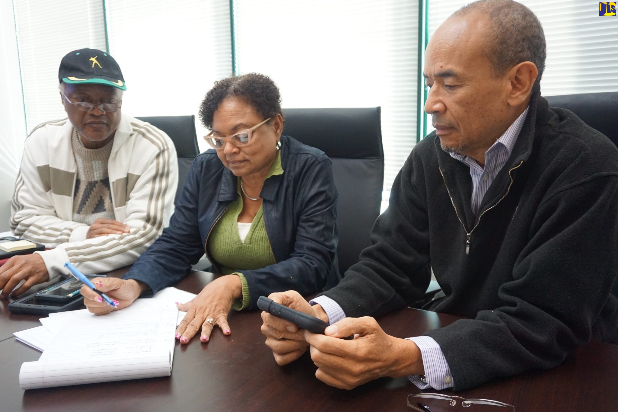 Members of a special fact-finding team, assessing the status of Jamaicans participating in the seasonal agricultural workers’ programme in Canada, meet at the Jamaican Liaison Service office in Toronto on Tuesday (October 11). The members (from left) are Deputy Chairman, Industrial Dispute Tribunal (IDT), Danny Roberts; President, Jamaica Confederation of Trade Unions (JCTU), Helene Davis-Whyte; and President, Caribbean Employers’ Federation (CEF), Wayne Chen.