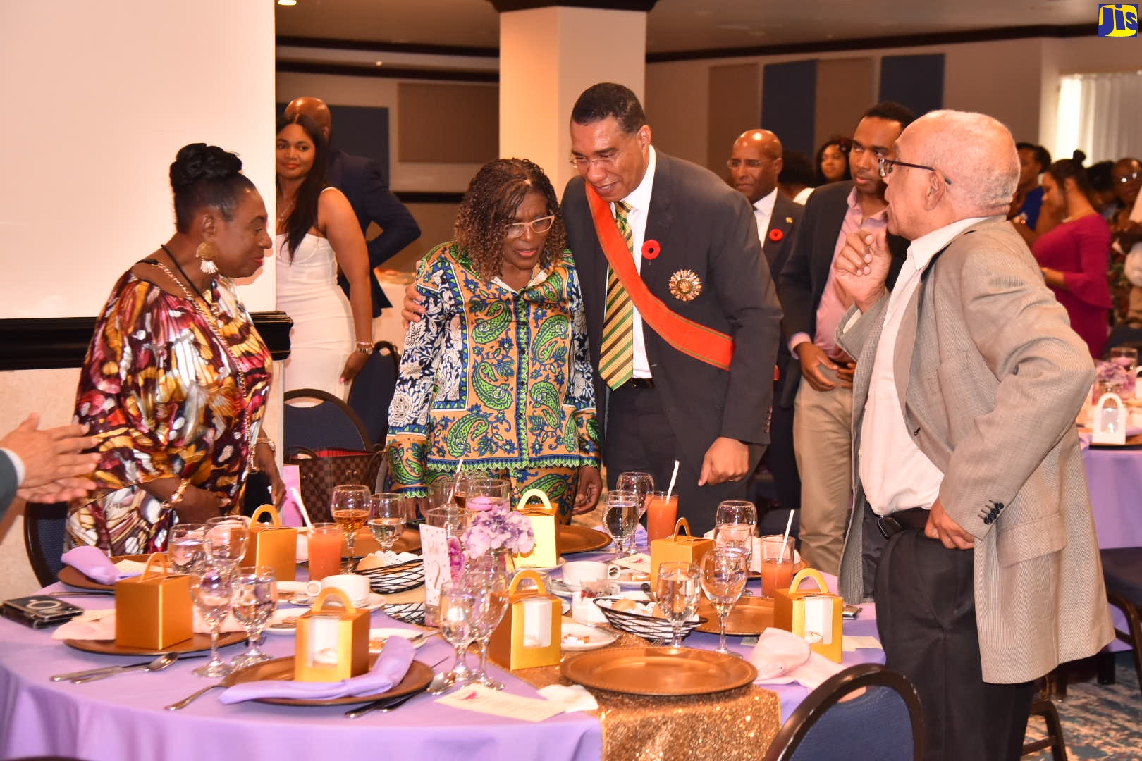 Prime Minister, the Most Hon. Andrew Holness (third left), congratulates Permanent Secretary in the Office of the Prime Minister and the Ministry of Economic Growth and Job Creation, Audrey Sewell (second left), on her Order of Jamaica (OJ) award, which was presented during the Ceremony of Investiture and Presentation of National Honours and Awards at King’s House on Monday (October 17). Mrs. Sewell was recognised for distinguished contribution to public service. The reception was held at The Jamaica Pegasus hotel in Kingston, Monday afternoon. Sharing the moment are Minister of Culture, Gender Entertainment and Sport, Hon. Olivia Grange, who also received the OJ and former Cabinet Minister, Dr. Omar Davies (right).