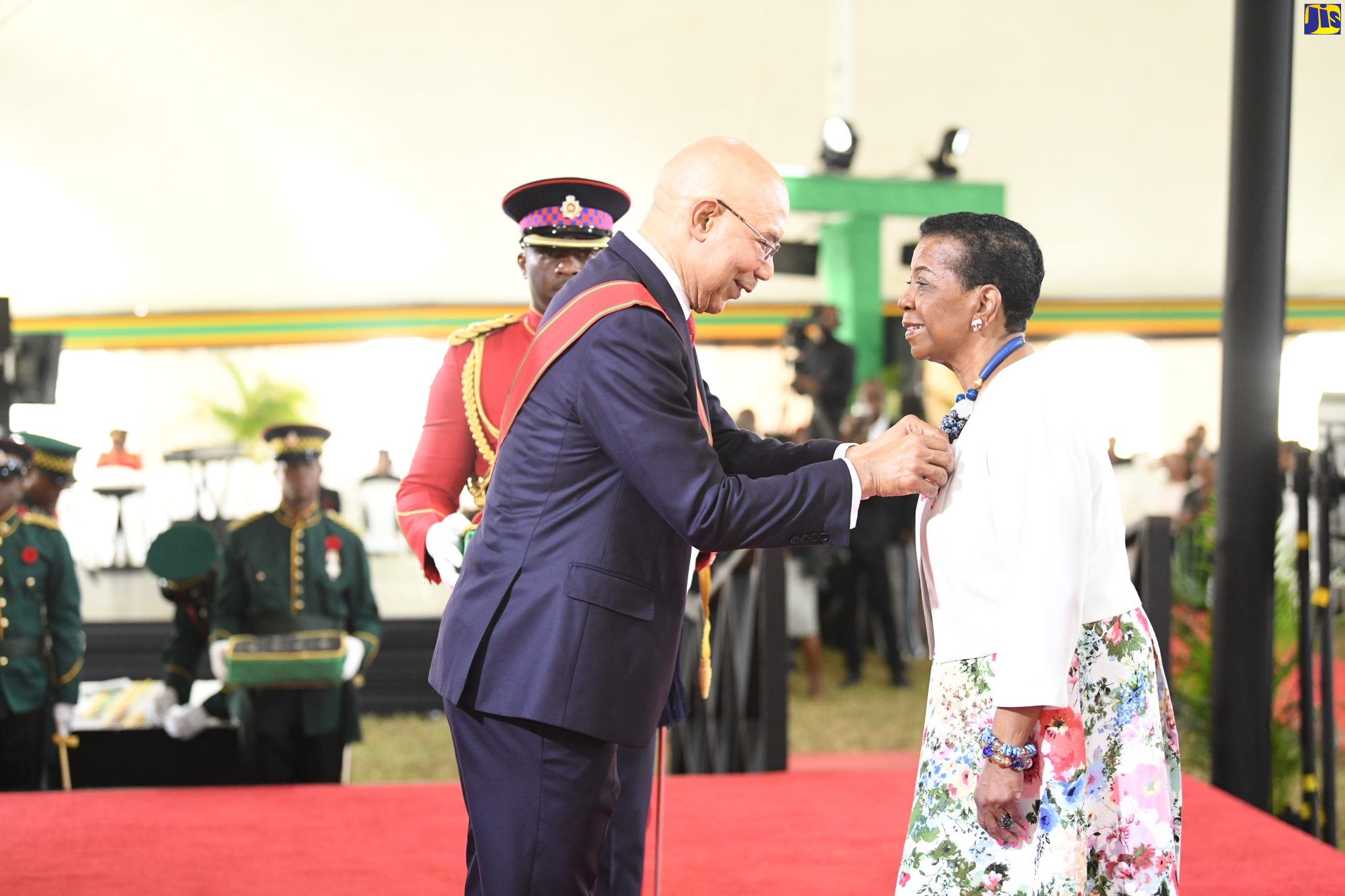 Governor General, His Excellency the Most Hon. Sir Patrick Allen (left), presents the Badge of Honour for Meritorious Service to Olive Parkins-Smith for outstanding contribution to the Jamaican Diaspora in Canada, during the National Honours and Awards ceremony held at King’s House, October 17.