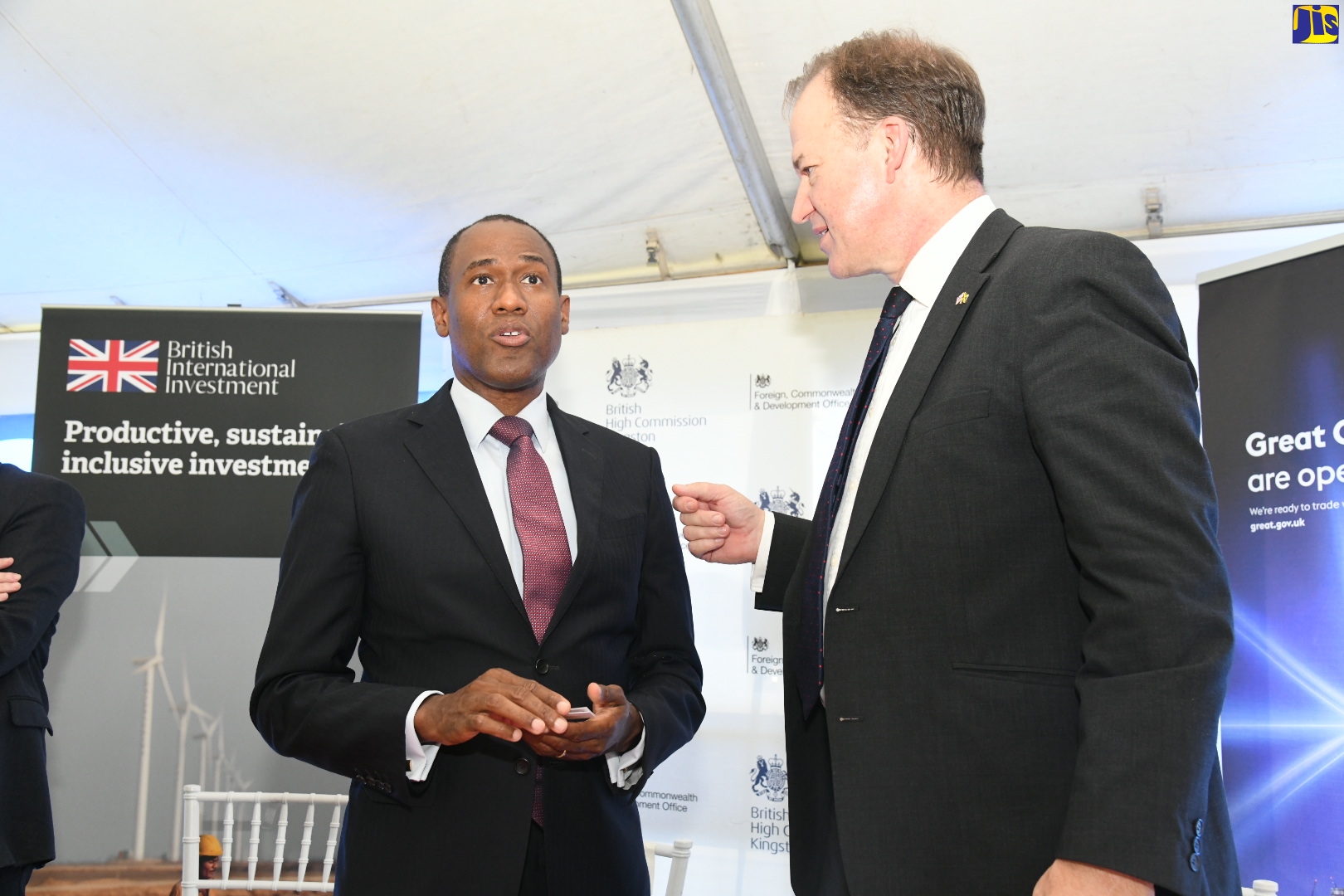 Minister of Finance and the Public Service, Dr. the Hon. Nigel Clarke (left), converses with Minister for the Americas and Overseas Territories, The Rt. Hon. Jesse Norman, at the launch of the British International Investment (BII) on Tuesday (October 25), at the British High Commission in Kingston.