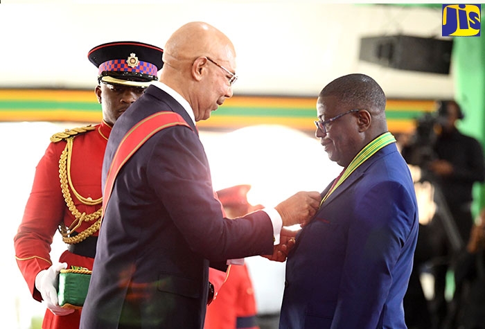 Governor General, His Excellency the Most Hon. Sir Patrick Allen, presents the Order of Distinction in the rank of Commander (CD) to Chief Executive Officer of the National Health Fund (NHF), Everton Anderson, at the National Honours and Awards ceremony held on October 17 at King’s House in Kingston.