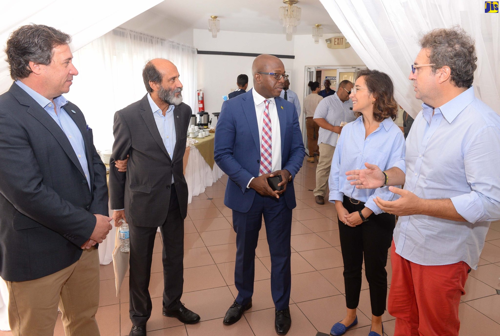 Minister of Agriculture and Fisheries, Hon. Pearnel Charles Jr. (centre), makes a point to Technical Specialist, International Fund for Agriculture Development (IFAD), Antonella Cianciotta (second right); and Lead Global Technical Specialist, IFAD, Marco Marzano de Marinis (right), at the launch of the Farmers’ Organizations for Africa, Caribbean and Pacific Learning Route, at the Altamont Court Hotel in Kingston on October 25. Others sharing in the conversation (from left) are Senior Policy Development Officer for Rural Development, Food and Agriculture Organization (FAO), Luiz Beduschi; and FAO Representative for Jamaica, The Bahamas and Belize, Dr. Crispim Moreira.