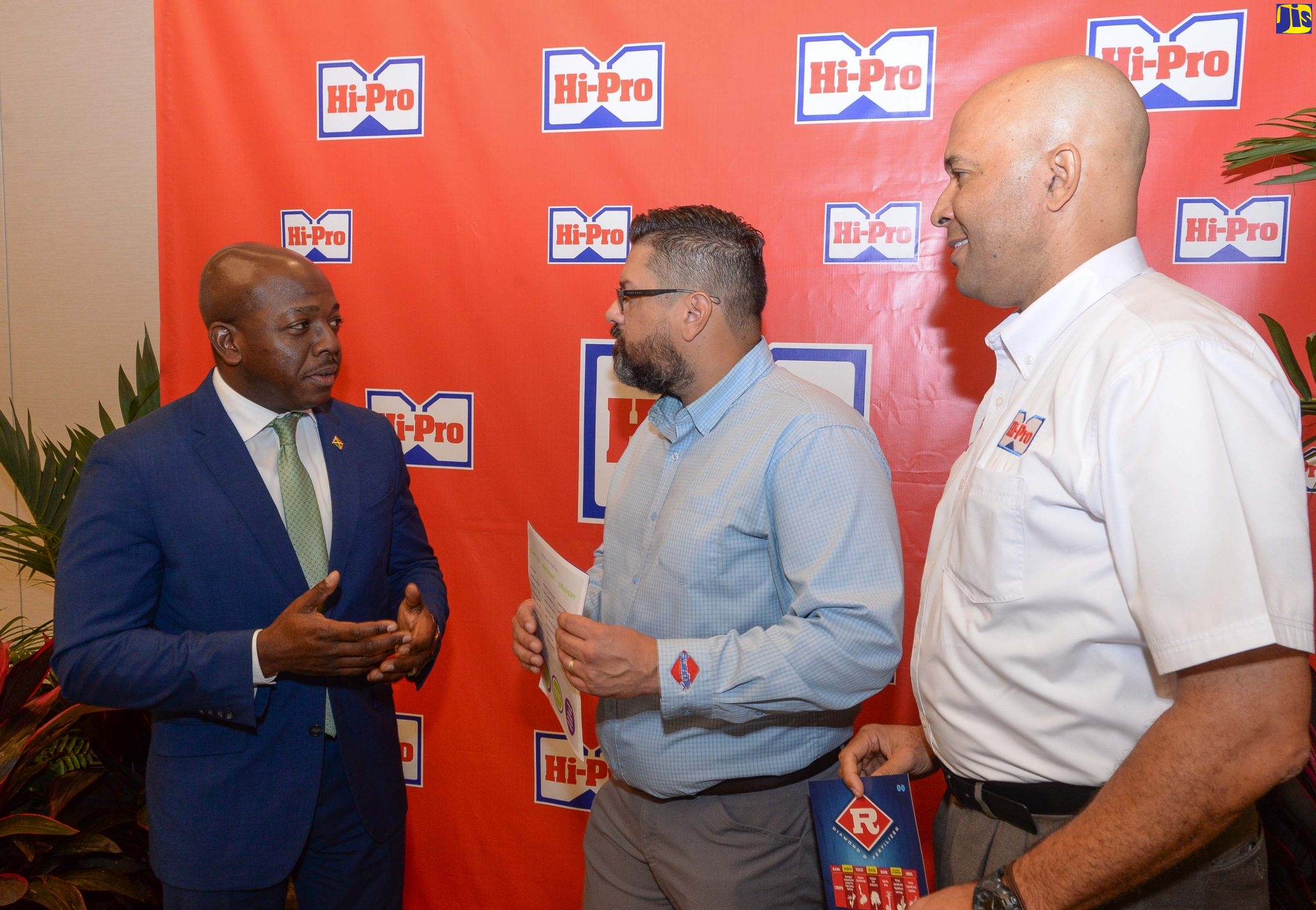 Minister of Agriculture and Fisheries, Hon. Pearnel Charles Jr. (left), is in discussion with Sales Representative for Diamond Fertiliser,  Orlando Rojas (centre), and Vice-President at Hi-Pro, Colonel (Ret’d) Jaimie Ogilvie, during the launch of the Diamond-R/Purkote Controlled Release Fertiliser (CRF) technology, at the AC Marriot Hotel in New Kingston on Wednesday (October 26).