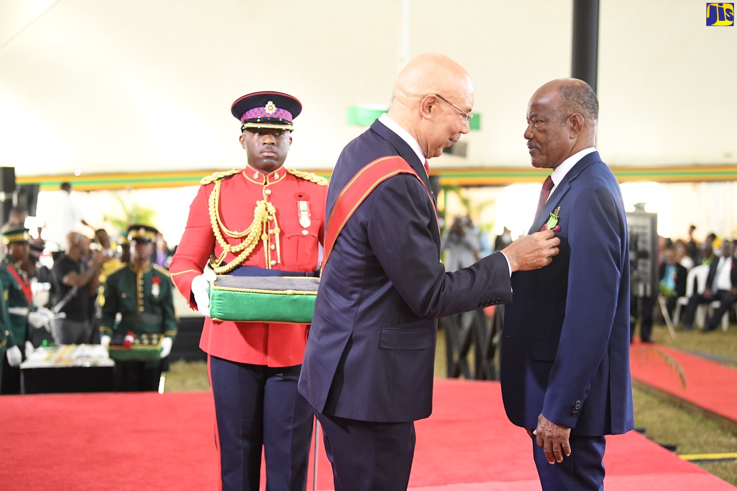Governor-General, His Excellency, the Most Hon. Sir Patrick Allen (centre), presents George Samuel Johnson (right) with the Order of Distinction (OD) in the rank of Officer (OD), during the 2022 Ceremony of Investiture and Presentation of National Honours and Awards, held at King’s House in Kingston on October 17.