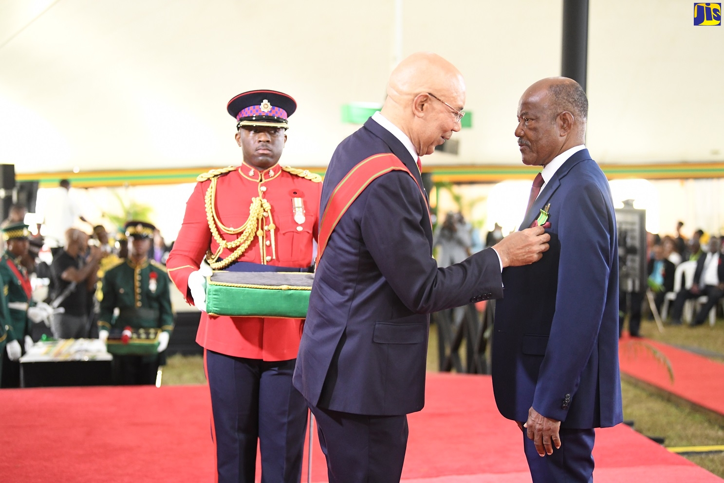 Governor-General, His Excellency, the Most Hon. Sir Patrick Allen (centre), presents George Samuel Johnson (right) with the Order of Distinction (OD) in the rank of Officer (OD), during the 2022 Ceremony of Investiture and Presentation of National Honours and Awards, held at King’s House in Kingston on October 17.

