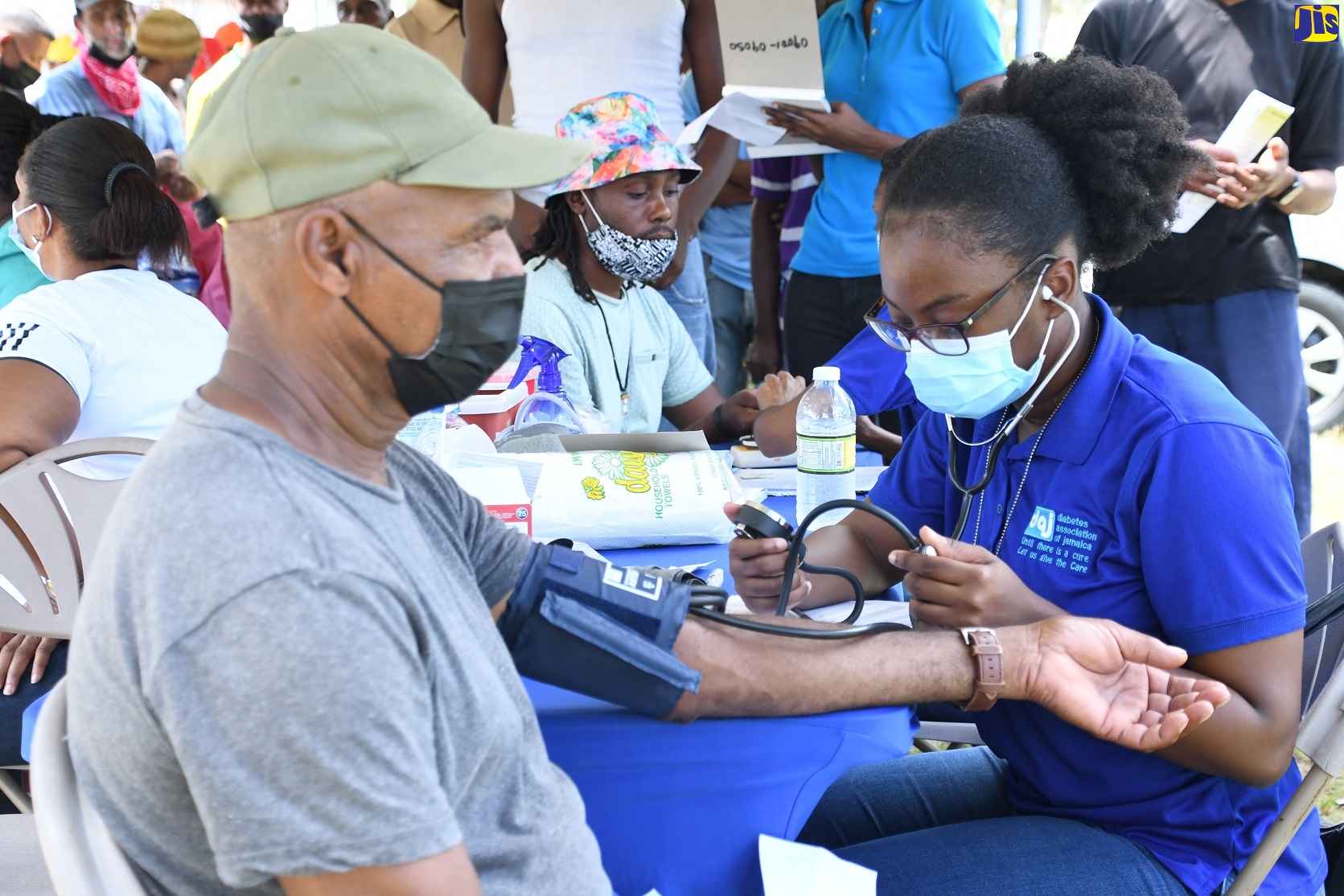 Nurse at the Diabetes Association of Jamaica, Deborah Dawes (right), conducts a blood-pressure check on 66-year-old tractor operator, Denham Ranken, during a health fair hosted by the Westmoreland Health Department on the grounds of the Pan Caribbean Sugar Factory at Frome in the parish on September 27.