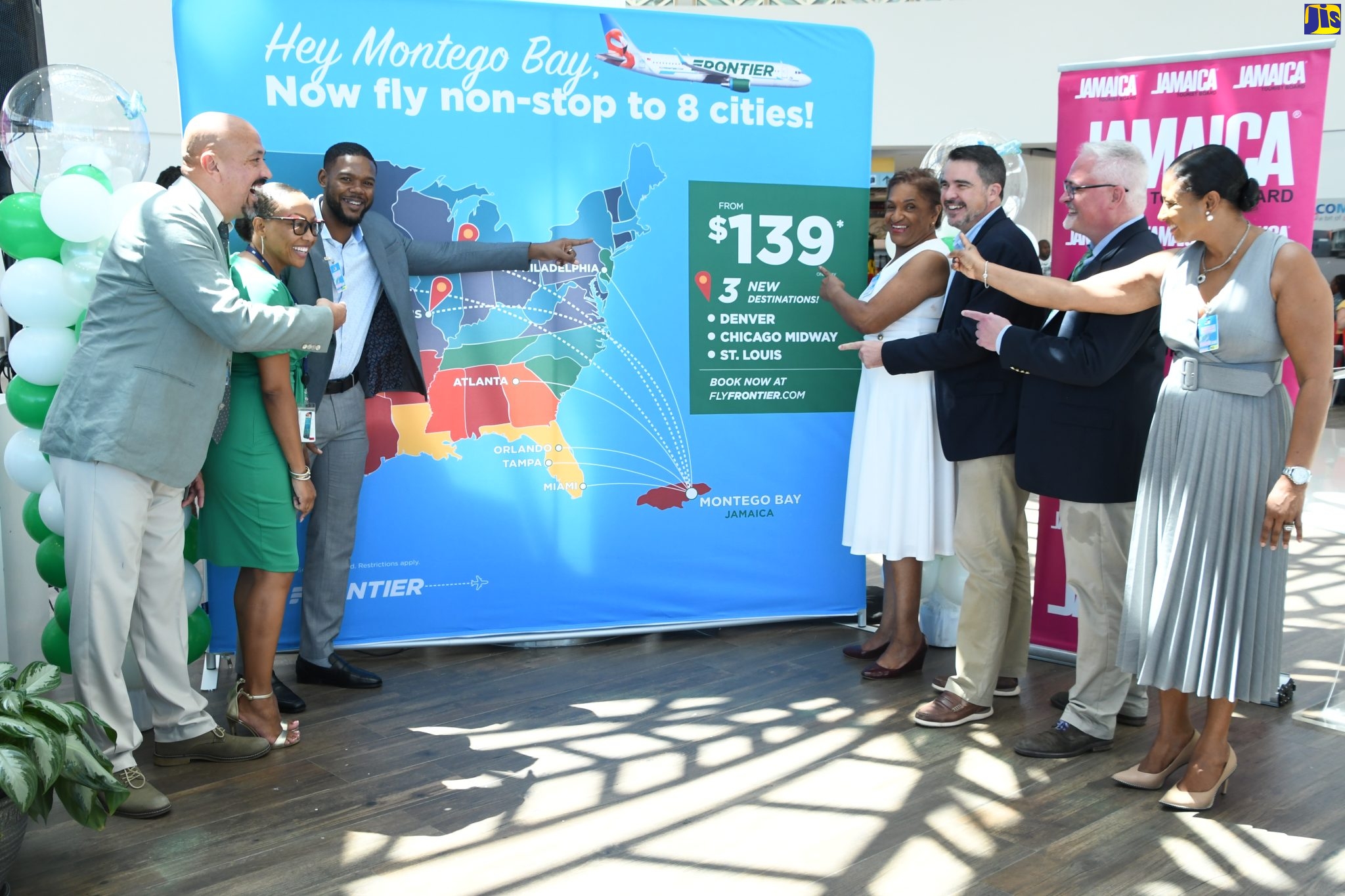 Tourism stakeholders point to the display announcing Frontier Airlines’ new seasonal non-stop flights from Denver, Colorado; Chicago, Illinois and St. Louis, Missouri, to the Sangster International Airport in St. James, beginning February 2023, at a ceremony held at the airport, on October 4. From left are International and Domestic Sales Manager at Frontier, Alfredo Gonzalez; Commercial Business and Marketing Manager at MBJ Airports, operators of Sangster International Airport, Sharon Hislop-Holt; Deputy Mayor of Montego Bay, Councillor Richard Vernon; Executive Director of Jamaica Vacations, Joy Roberts; Deputy Chair of the Jamaica Hotel and Tourist Association (JHTA), Montego Bay Chapter, Raphael Mattas; Senior Manager of International Sales at Frontier, William Evans; and Regional Manager at the Jamaica Tourist Board (JTB), Odette Dyer.