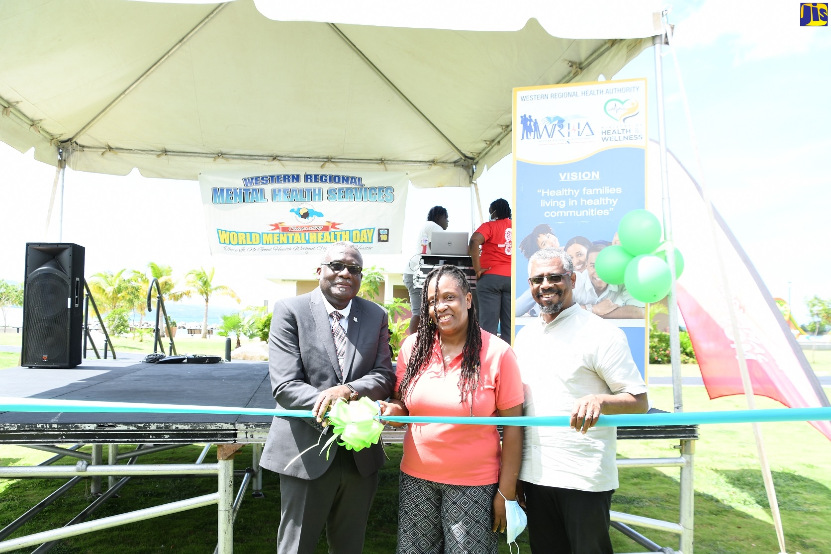 Custos of St James, Bishop  Conrad Pitkin (left) cuts the ribbon to officially open a two-day wellness village at the Harmony Beach Park in Montego Bay, St James, on March 10. He is joined by Regional Psychiatrist with the Western Regional Health Authority (WRHA), Dr. Lisabeth Crossman (centre) and Campus Director at the University of the West Indies (UWI) Western Jamaica Campus, Dr. Patrick Prendergast. The event is part of activities to mark Mental Health Week, which is being observed from October 9-17.