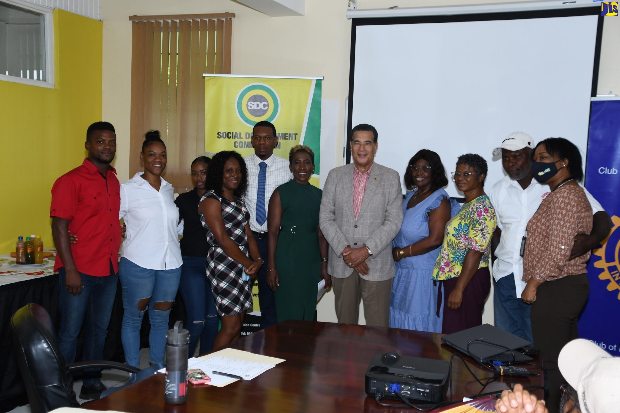 Minister of State in the Office of the Prime Minister (West), Hon. Homer Davis (seventh left), shares a moment with operators of local economic initiatives (LEIs) in St. James and representatives of the Social Development Commission (SDC) and Rotary Club of Montego Bay, during the SDC’s Economic Empowerment Forum at the entity’s St. James Office at Albion in Montego Bay on Thursday, October 13.