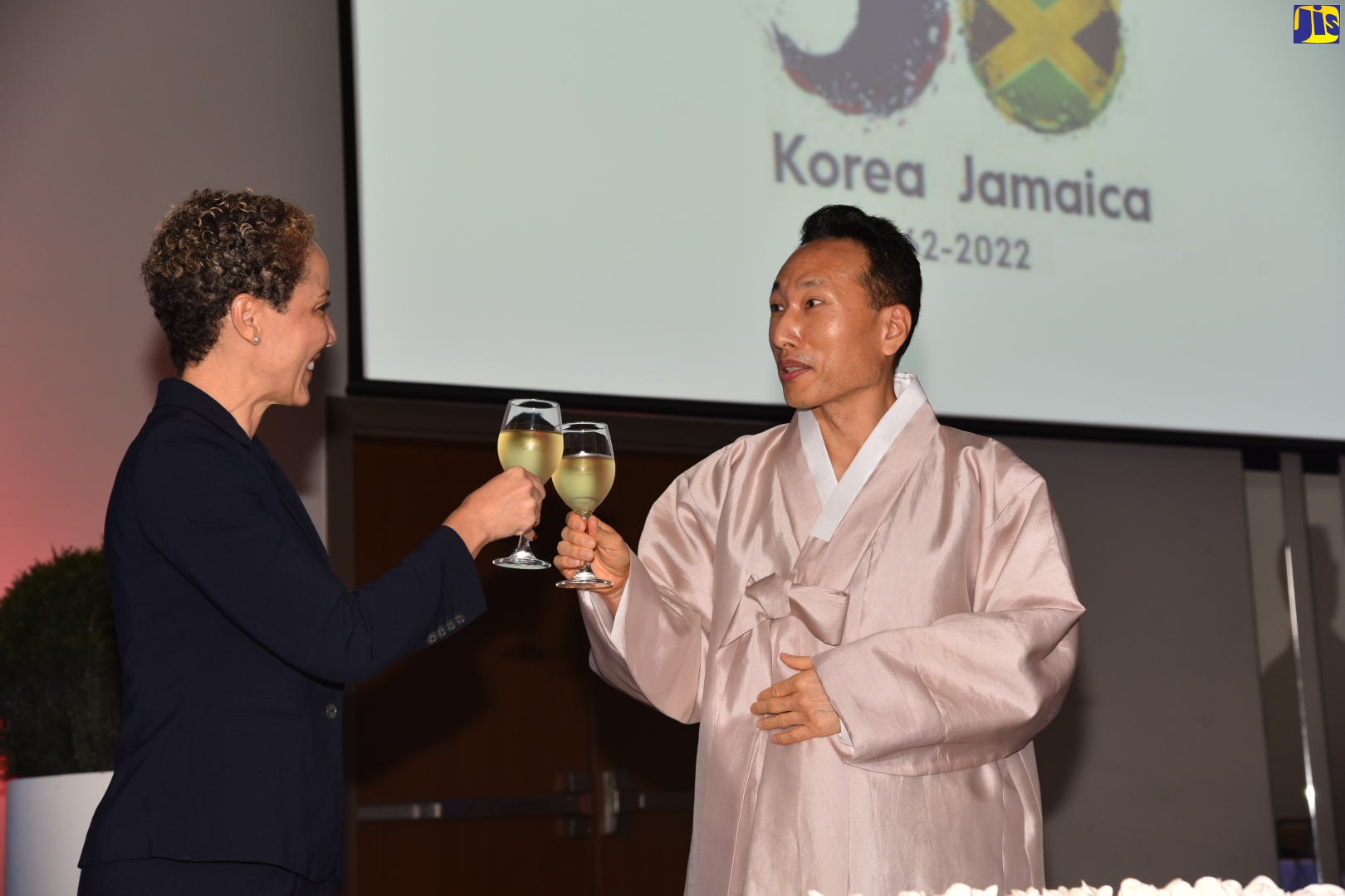 Minister of Foreign Affairs and Foreign Trade, Senator the Hon. Kamina Johnson Smith (left) and Charge d’Affaires of the Republic of Korea in Jamaica, Lim Baejin, raise a toast to celebrate Korea’s National Day and Diamond Jubilee, observed on October 6, during a reception held recently, at the AC Marriott Hotel, Kingston. 