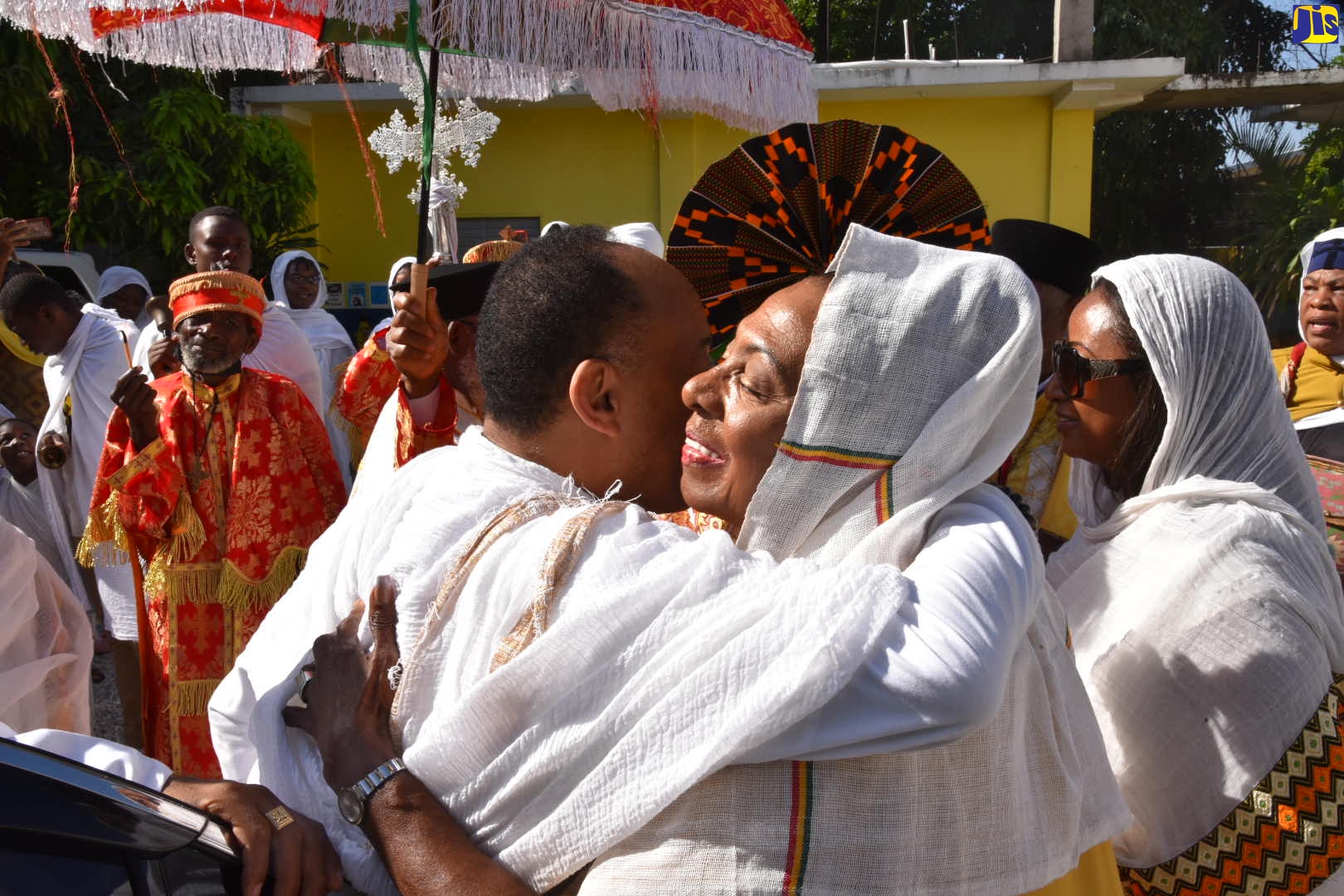 Minister of Culture, Gender, Entertainment and Sport, Hon. Olivia Grange (left), embraces President of the Crown Council of Ethiopia, His Imperial Highness, Prince Ermias Sahle Selassie, at a service held at the Ethiopian Orthodox Church, Maxfield Avenue, Kingston on October 16.