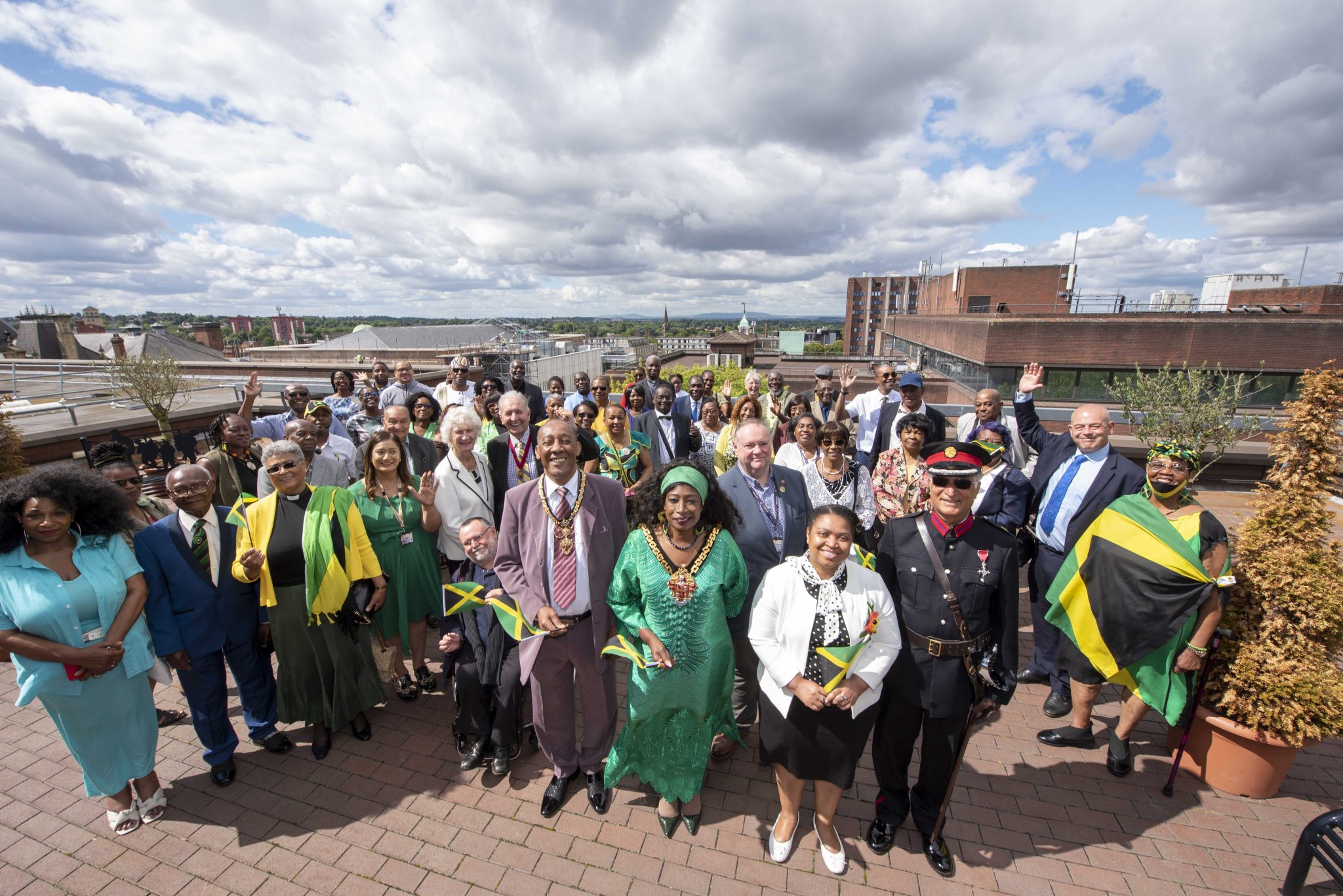 Jamaican-born Mayor of Wolverhampton, United Kingdom (UK), Councillor Sandra Samuels (second left), her husband, Karl (left), and other persons celebrate the 60th Anniversary of Jamaica’s Independence, at the African Caribbean Centre (The Hub) in Wolverhampton,  on August 6, 2022.