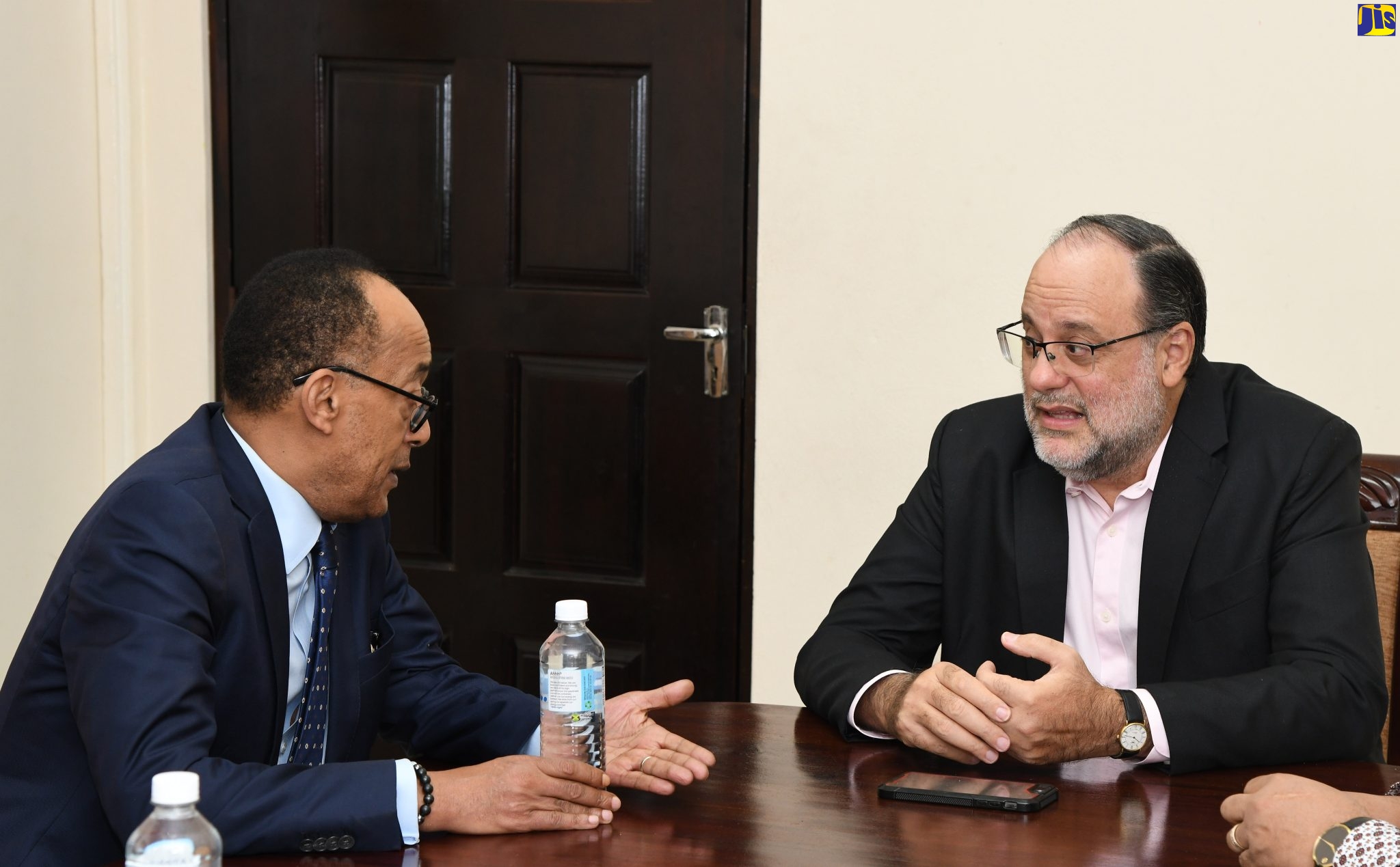 President of the Crown Council of the Federal Democratic Republic of Ethiopia, His Imperial Highness, Prince Ermias Sahle Selassie (left) speaks with Leader of the Opposition, Mark Golding during a courtesy call at Mr. Golding’s office on West King’s House Road in Kingston on Tuesday (October 18). 