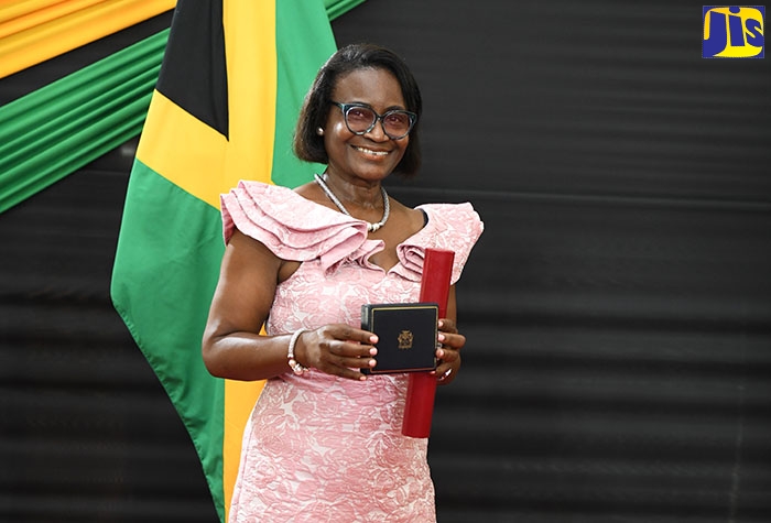 Winsome Vanhorne Christie with her Badge of Honour for Meritorious Service, for loyal and outstanding service to the Public Sector, on Heroes Day, October 17, at King’s House.