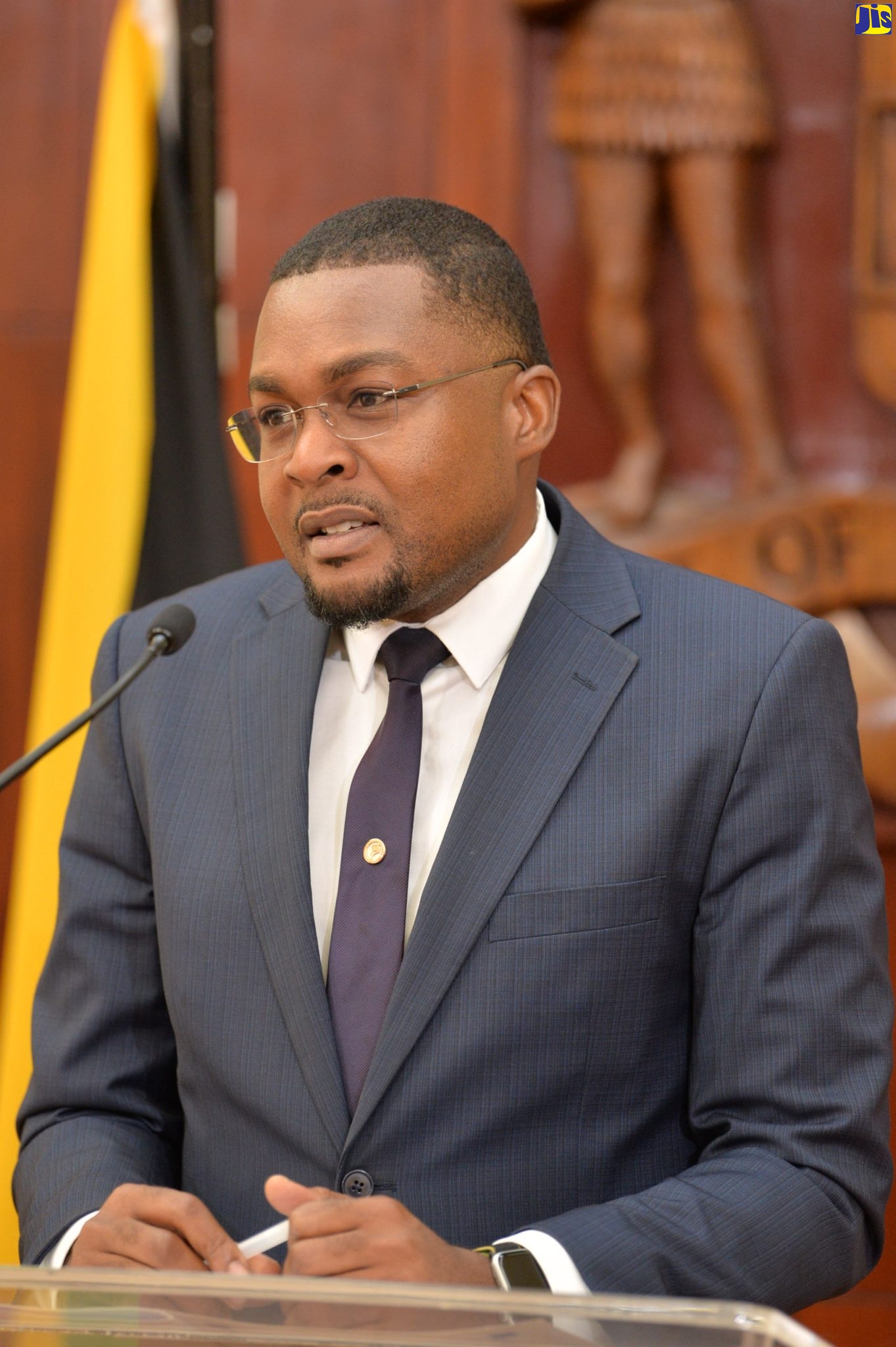 Minister Without Portfolio with responsibility for Information in the Office of the Prime Minister,  Hon. Robert Morgan, speaking at a post-Cabinet press briefing held at Jamaica House in Kingston recently.