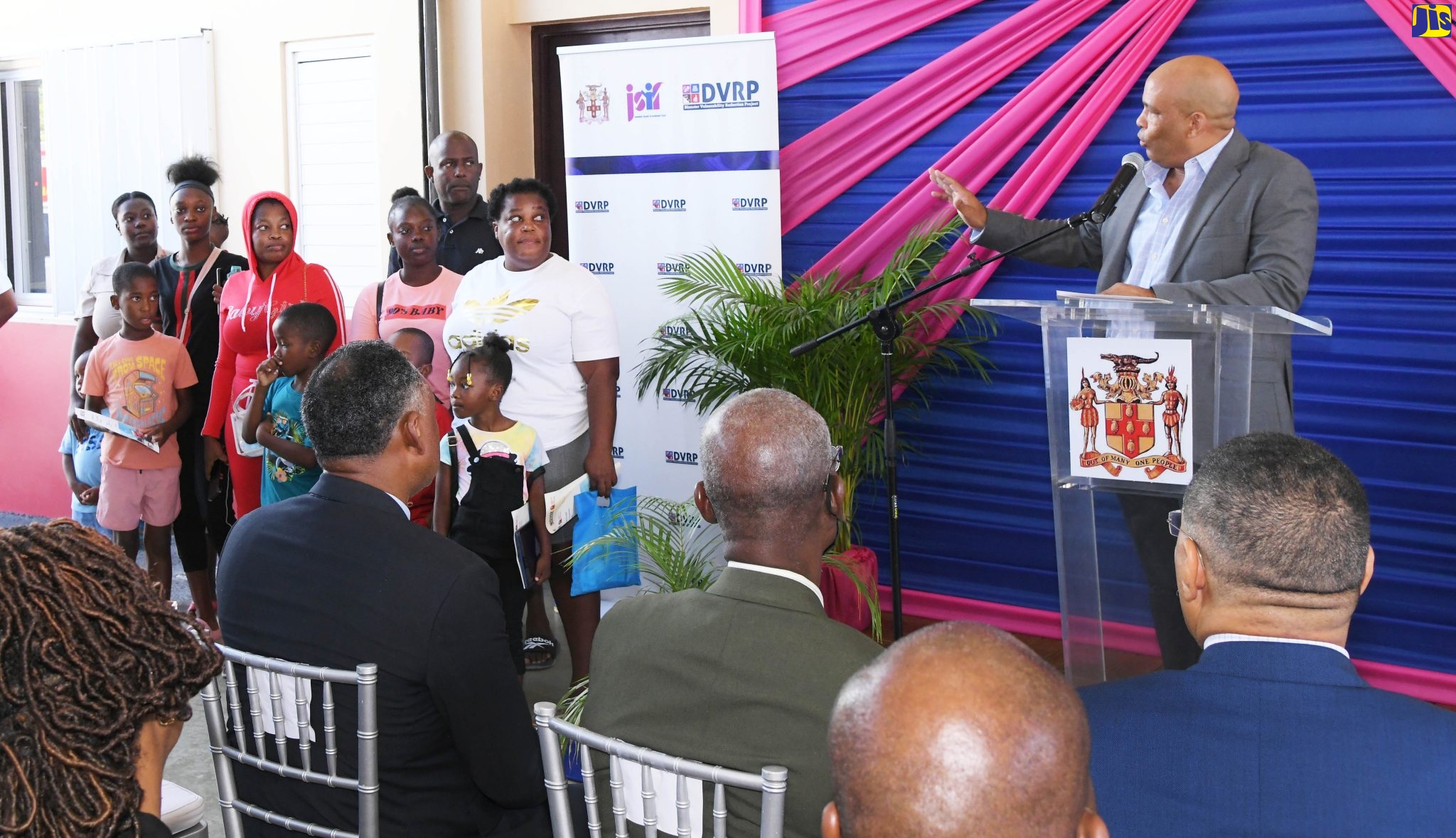 Member of Parliament for St. Thomas Western, James Robertson (right), assures St. Thomas residents, whose homes were destroyed by fire recently, of the Government’s support. Occasion was the opening ceremony for the new Yallahs Fire Station in the parish on Wednesday (October 26).