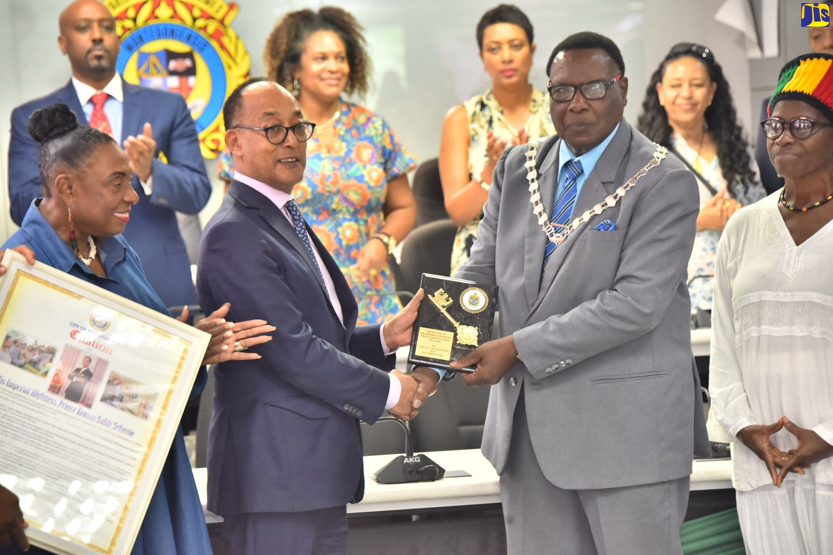 Minister of Gender, Culture, Entertainment and Sport, Hon. Olivia Grange (left), applauds as President of the Crown Council of the Federal Democratic Republic of Ethiopia, His Imperial Highness, Prince Ermias Sahle Selassie (second left), receives the symbolic Key to the city of Montego Bay from Mayor Leeroy Williams (second right), during a ceremony at the St. James Municipal Corporation, on Saturday (October 15). Sharing the moment is Secretary of the Rastafari Coral Gardens Benevolent Society, Pamela Rowe Williams.