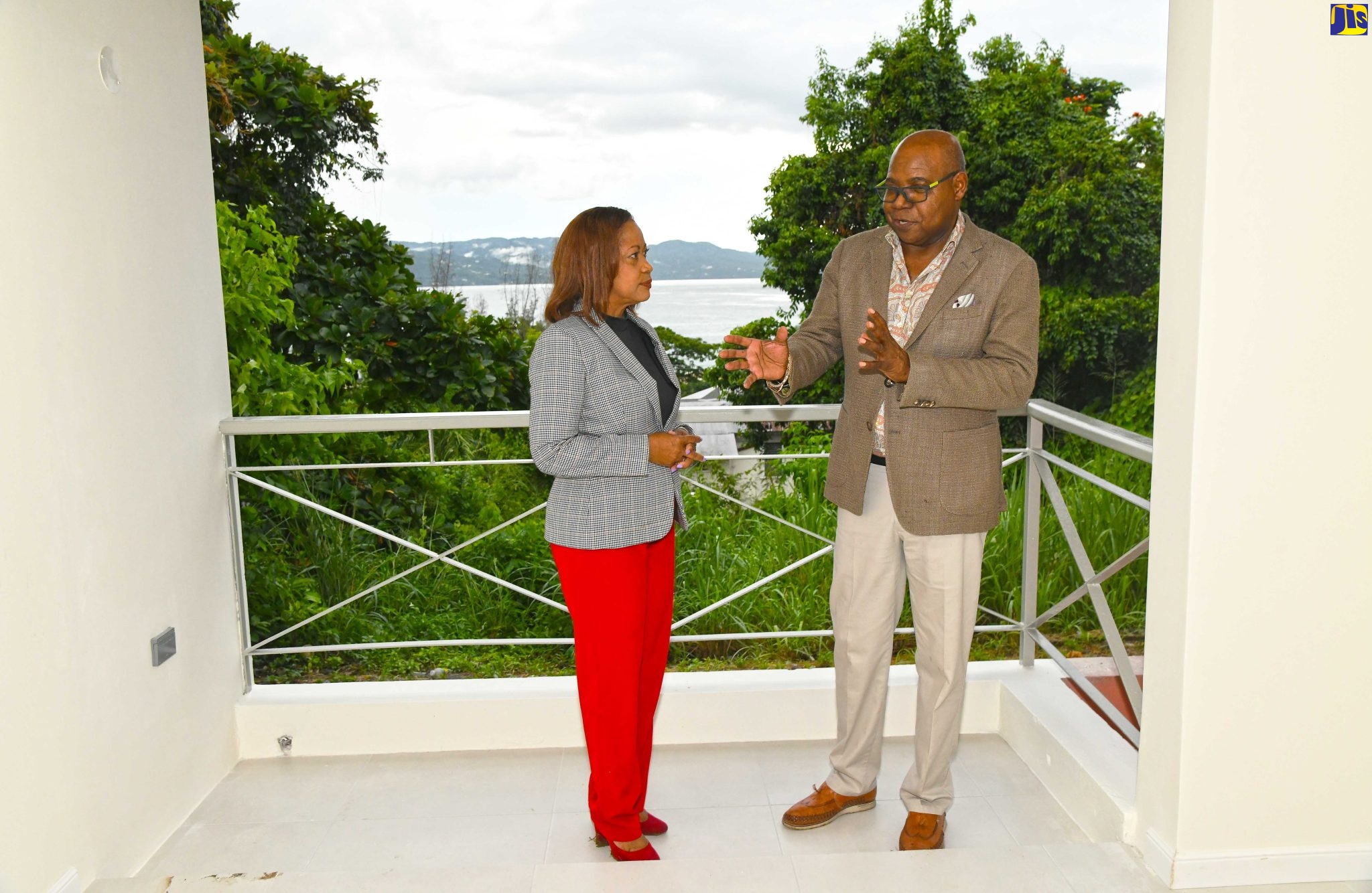 Minister of Tourism, Hon. Edmund Bartlett (right), converses with Director of The Vista Montego Bay Resorts Development Limited, Claudette Crooks, during a tour of the project site for a new US$100-million project in Montego Bay, St. James. Occasion was the project’s official ground-breaking on October 21.