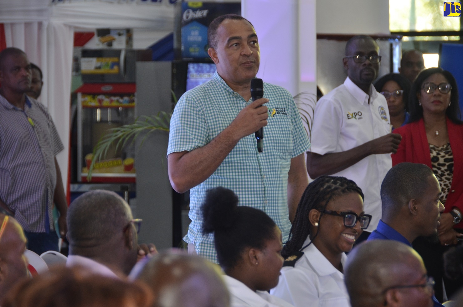 Minister of Health and Wellness, Dr. the Hon. Christopher Tufton (left), addresses a forum during the Montego Bay Chamber of Commerce and Industry (MBCCI) MoBay Expo 2022, held at the Montego Bay Convention Centre, Rose Hall, St. James, on November 4.