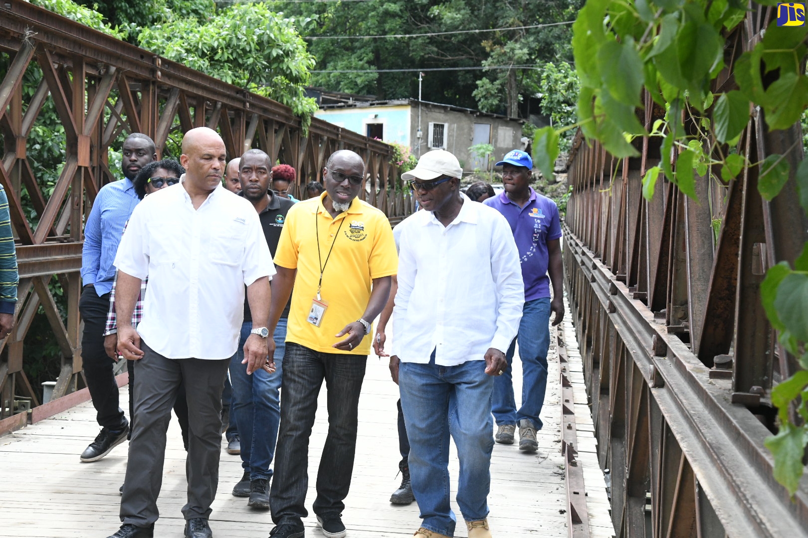 Minister without Portfolio in the Ministry of Economic Growth and Job Creation, Hon. Everald Warmington (right), walks across the Falling River Bridge in St. Thomas Western, during a tour of the constituency on Wednesday (November 2). With the Minister are National Works Agency Communications and Customer Services Manager, Stephen Shaw (centre) and Member of Parliament for St. Thomas Western, James Robertson.