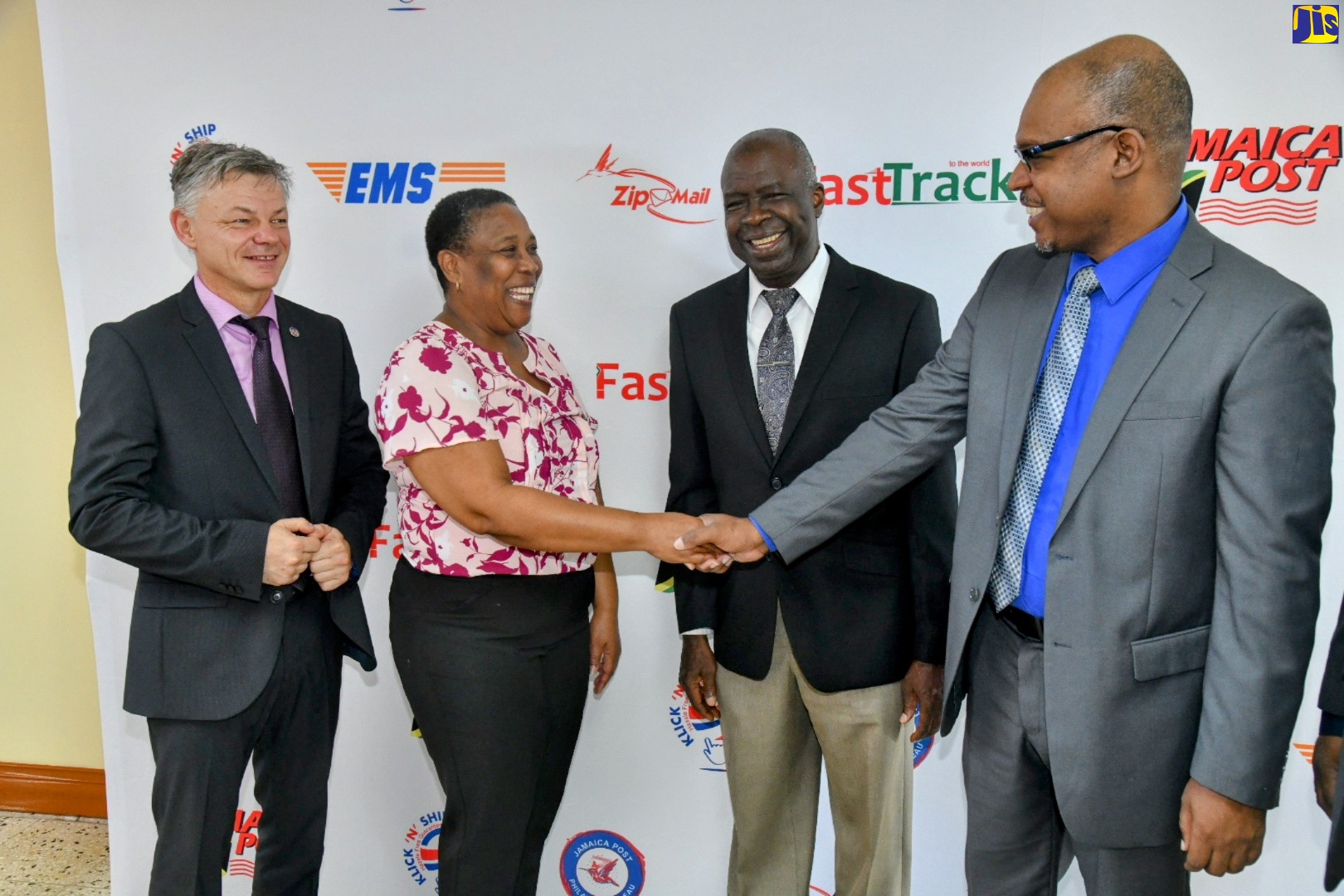 Postmaster General, Post and Telecommunications Department/Jamaica Post, Lincoln Allen (right), greets Secretary General, Caribbean Postal Union (CPU), Clare Seraphin-Wallace (second left). Looking on (from left) are Transport Programme Manager, Universal Postal Union (UPU), Jan Bojnansky, and Postal Corporation of Jamaica Chairman, Professor Felix Akinladejo. The occasion was the opening ceremony of the Caribbean Transportation Hub Think Tank meeting being held from November 28 to 30. It is being hosted by Jamaica Post/Post and Telecommunications Department.