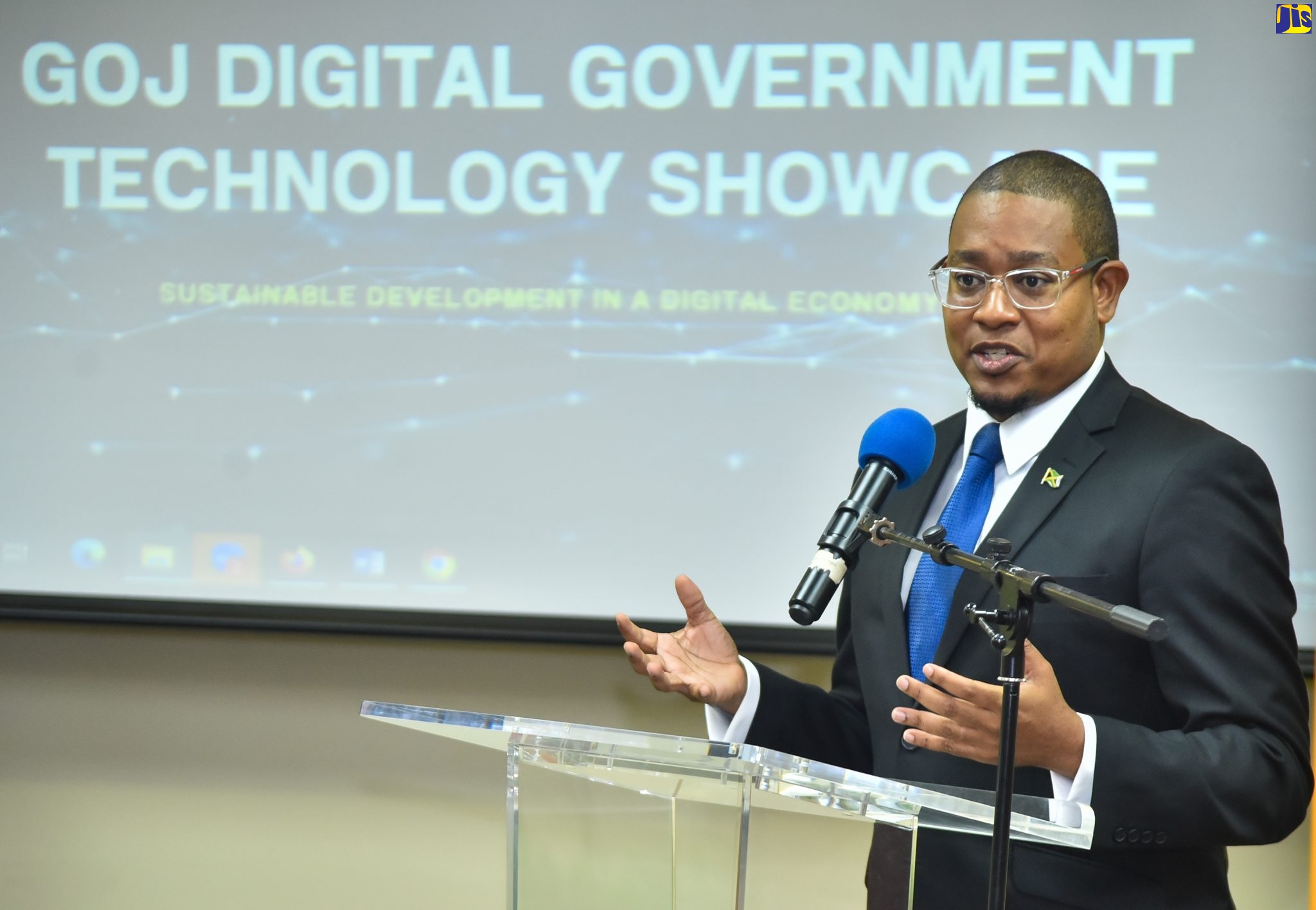 Minister without Portfolio in the Office of the Prime Minister, Hon. Floyd Green, speaks at the GOJ Technology Showcase that was hosted by e-GOV Jamaica Limited, on November 23, at the University of the West Indies Regional Headquarters.