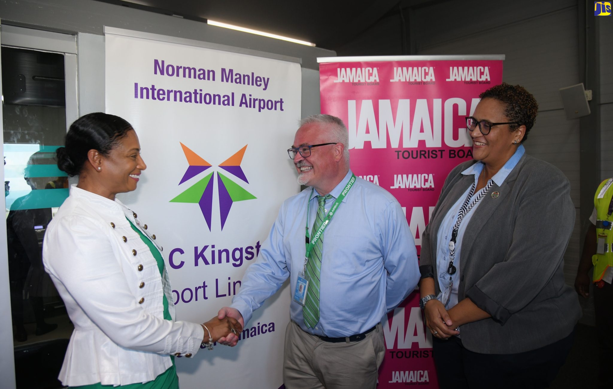 Regional Director at the Jamaica Tourist Board (JTB), Odette Soberam-Dyer (left), greets Senior Manager for International Marketing and Sales at Frontier Airlines, William Evans, at the Norman Manley International Airport (NMIA), on the arrival of passengers from the airline’s inaugural flight from Atlanta in the United States (US), to Kingston, on November 7. At right is Director at Kingston Airport Limited, Theresa Benjamin.