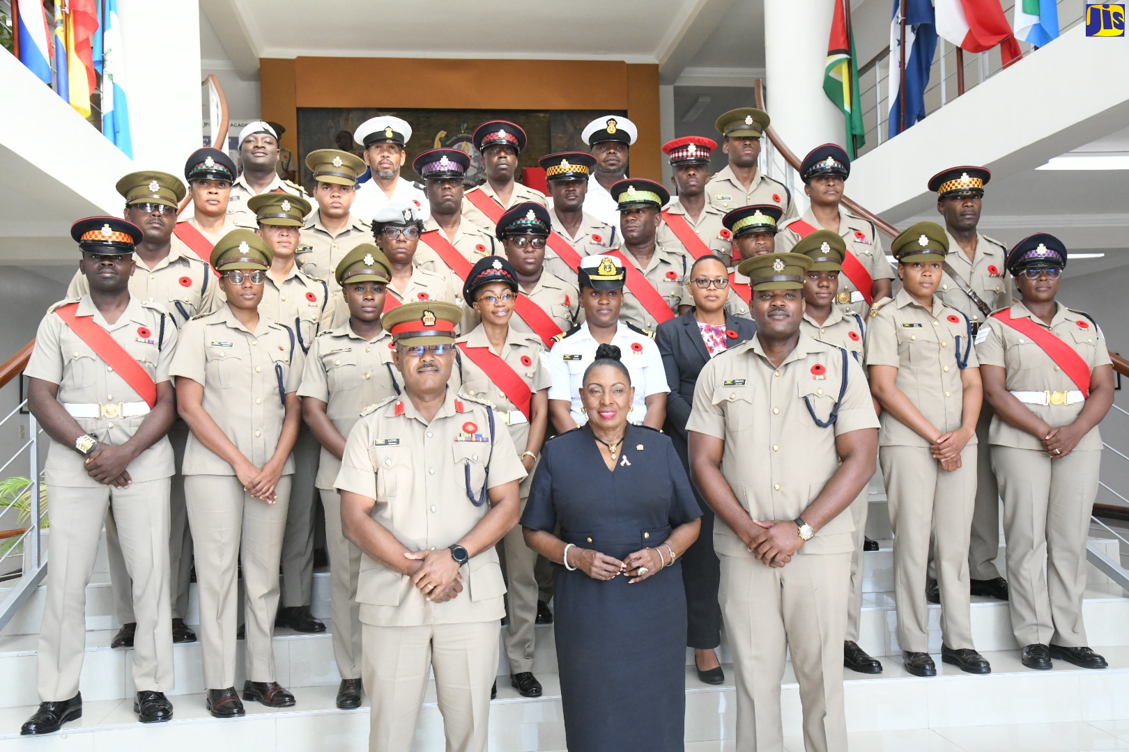 Minister of Culture, Gender, Entertainment and Sport, Hon. Olivia Grange (centre, front row) is pictured with Acting Chief of Defence Staff, Jamaica Defence Force (JDF), Brigadier Markland Lloyd (front row, left), and Force Gender Advisor, Major Andre Dennis (front, right), along with service members, at the Ministry’s Gender Mainstreaming Certification Ceremony held recently at Up Park Camp, Kingston. The certification ceremony acknowledged the JDF for its ongoing efforts in supporting the Government’s gender mainstreaming mandate, since its first Gender Focal Points (GFP) training for identified service members in 2019. 