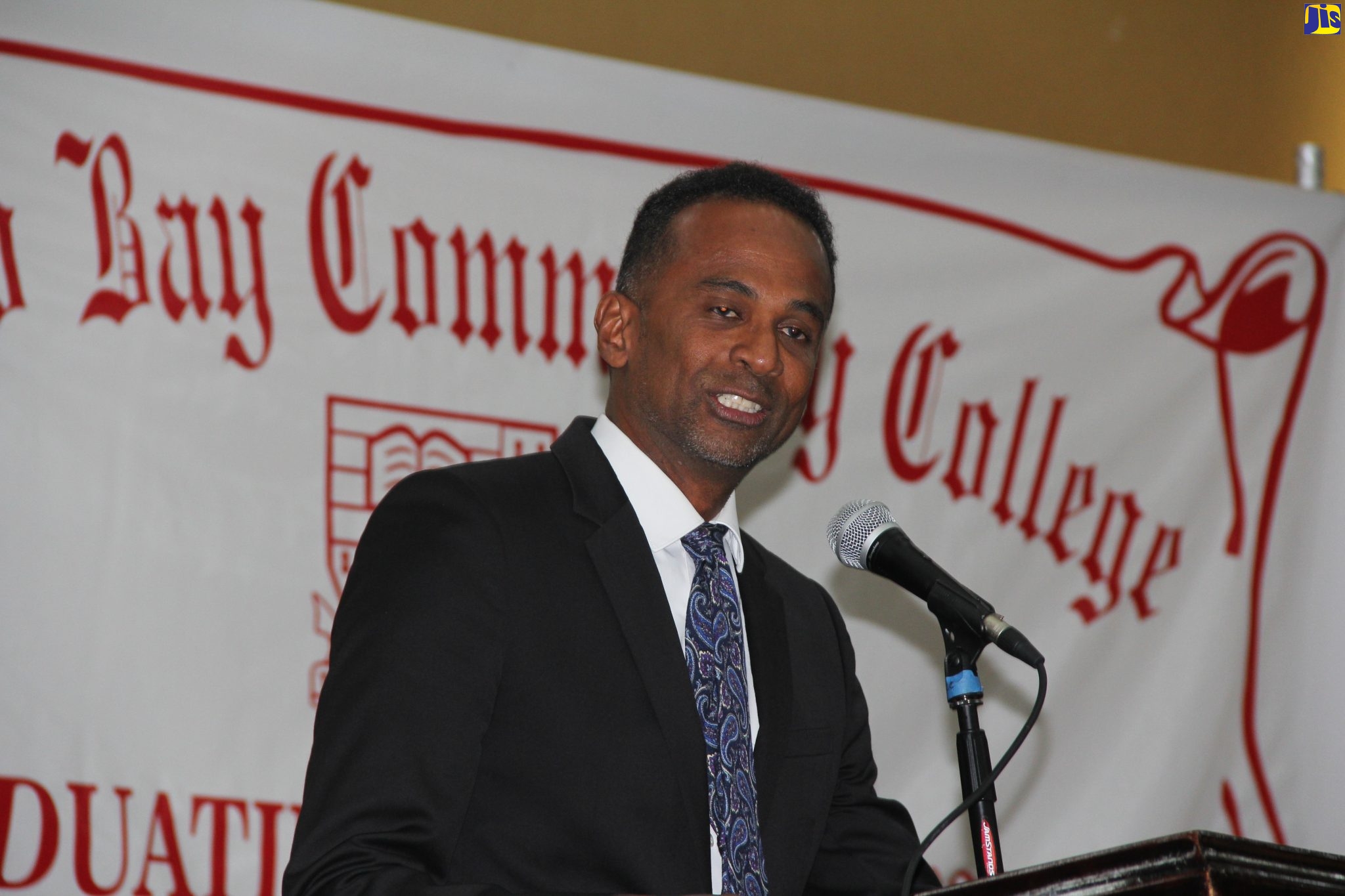 Executive Director of the Tourism Enhancement Fund (TEF), Dr. Carey Wallace, delivers the keynote address at the Montego Bay Community College (MBCC) graduation ceremony, held at the Montego Bay Convention Centre in St. James, on November 20.