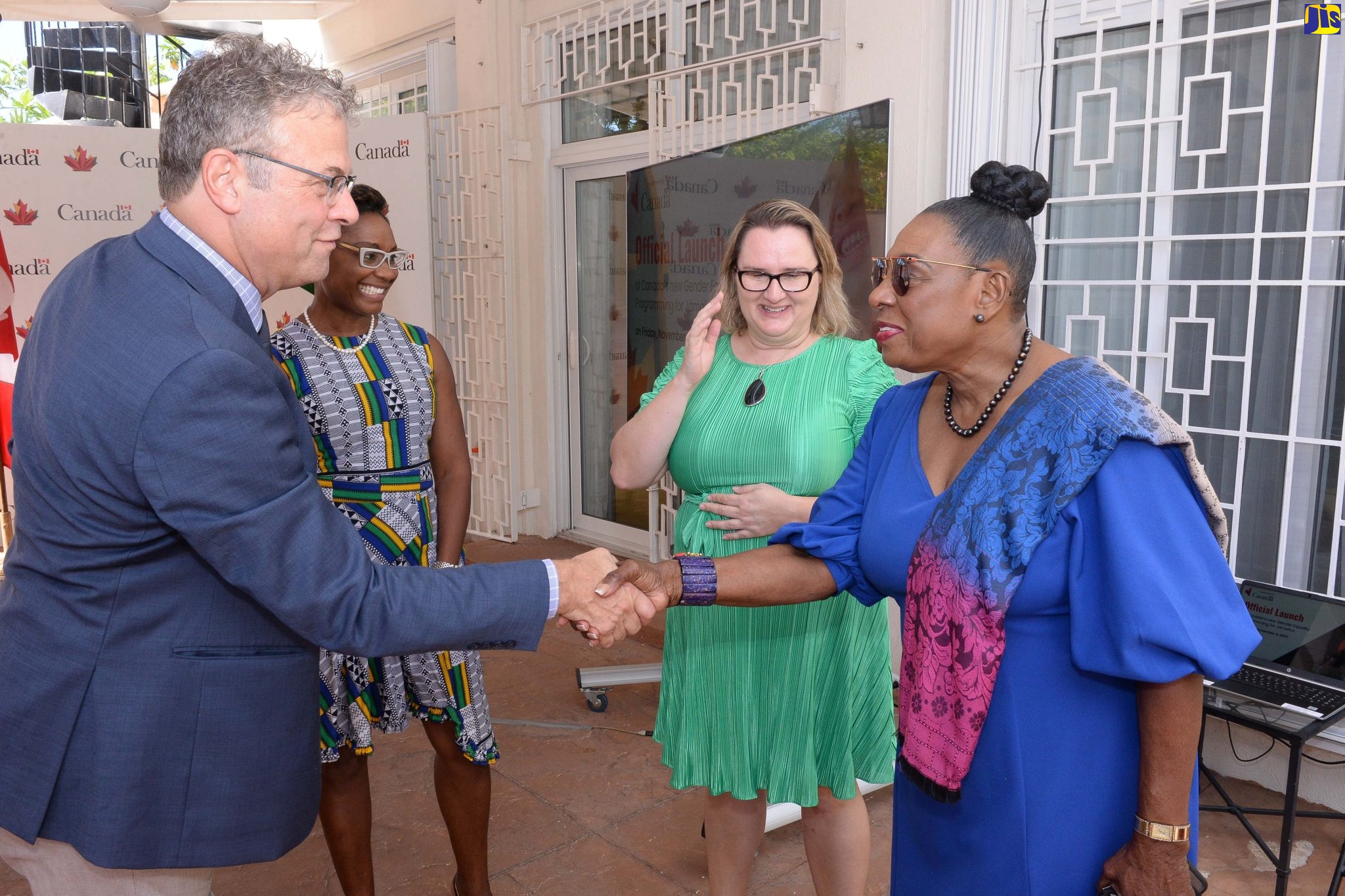 Minister of Culture, Gender, Entertainment and Sport, Hon. Olivia Grange (right), greets Head of the Development Cooperation at Global Affairs   Canada, Christian DaSilva, during the launch of the Gender Equality Programming initiative, on Friday (November 4). The event took place at the residence of Canada’s High Commissioner to Jamaica, in St. Andrew. Others (from second left) are Minister of State in the Ministry of Health and Wellness, Hon. Juliet Cuthbert-Flynn, and Canadian High Commissioner to Jamaica, Her Excellency Emina Tudakovic.