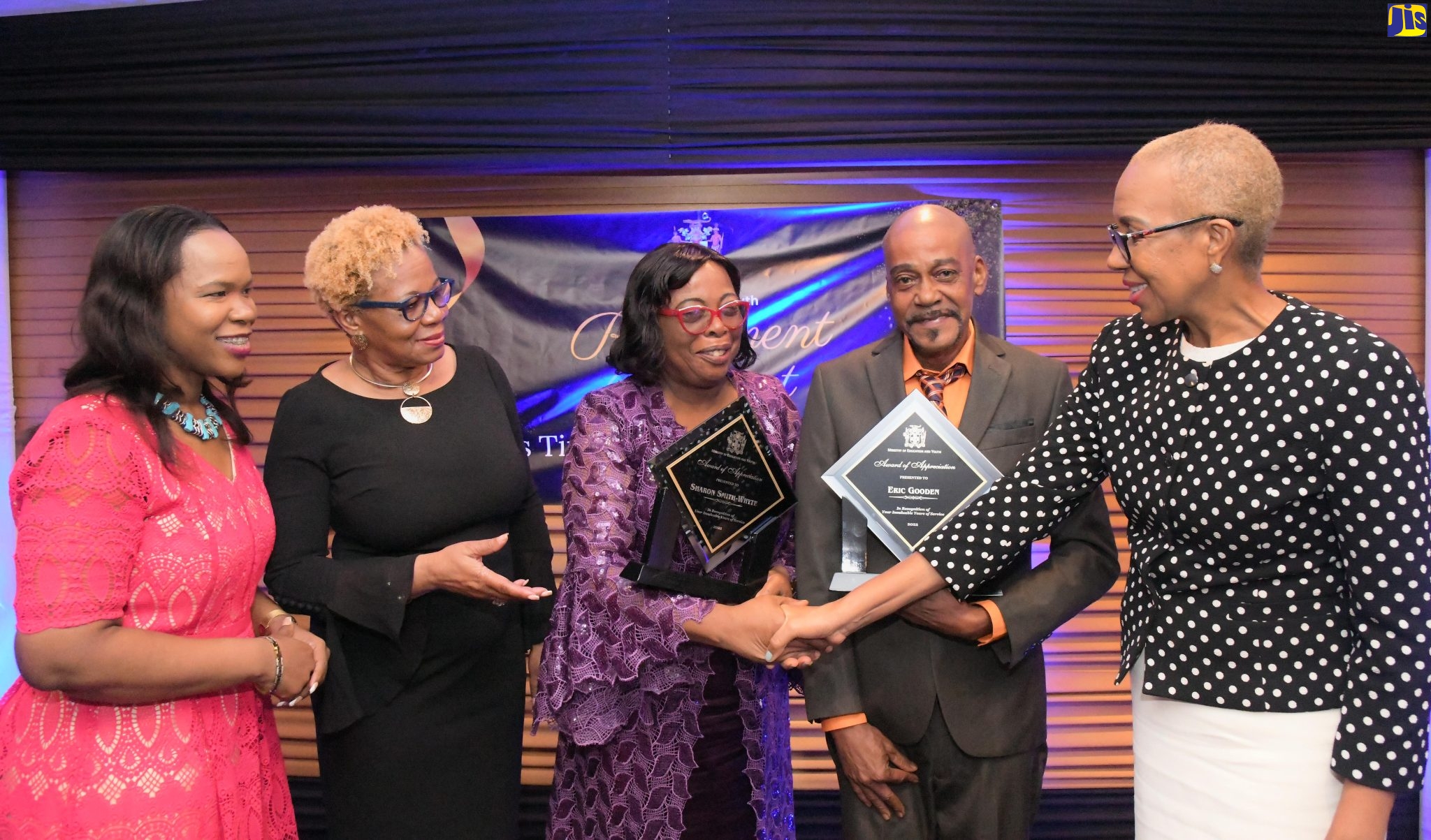 Minister of Education and Youth, Hon. Fayval Williams (right), greets retirees of the Ministry Sharon Whyte (centre), and Erie Gooden (second right), during a retirement awards banquet at the Jamaica Pegasus Hotel in New Kingston, on Thursday (November 3). Sharing the moment (from left) are Acting Chief Education Officer, Dr. Kasan Troupe, and Acting Permanent Secretary, Maureen Dwyer.