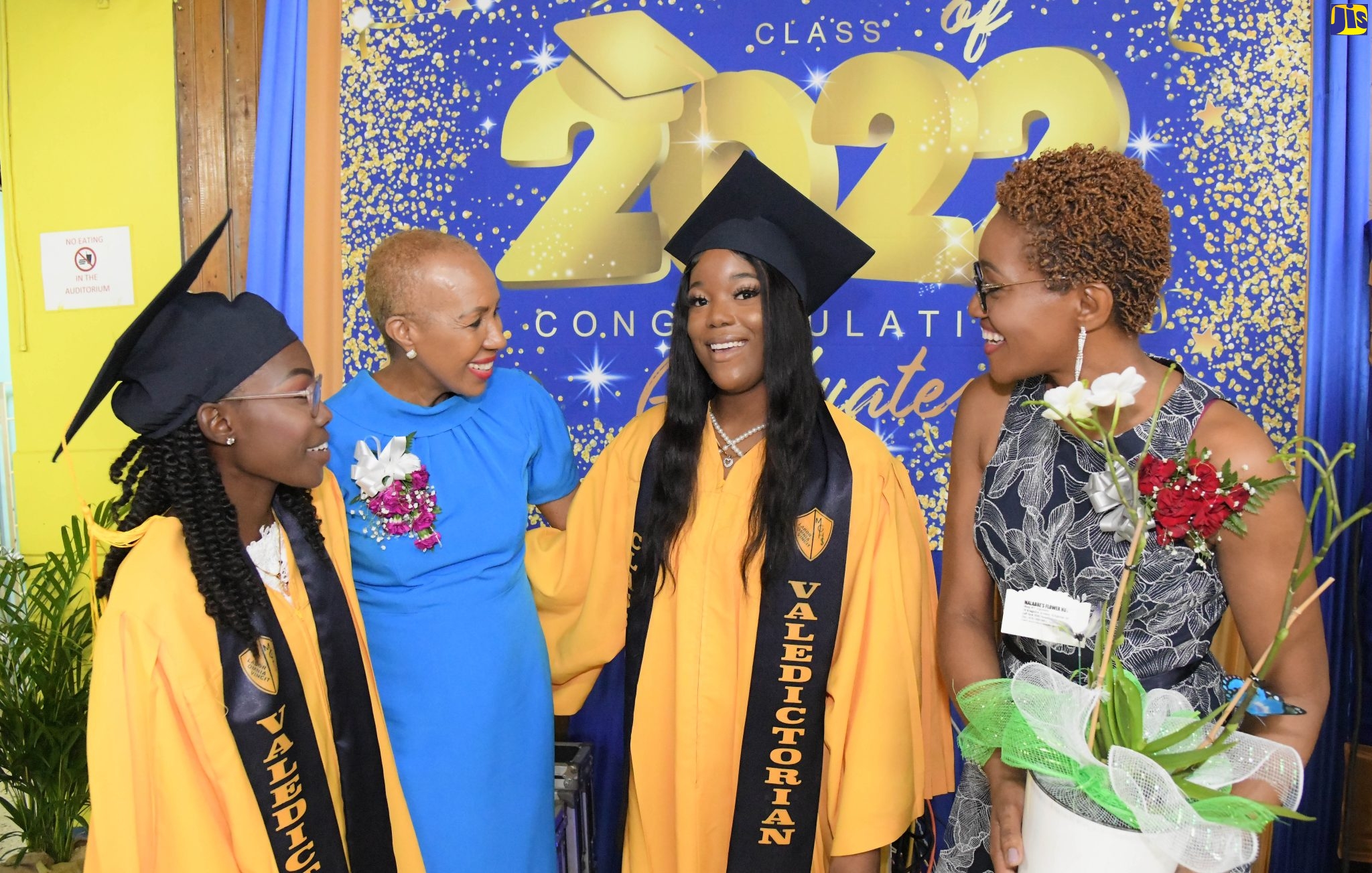 Minister of Education and Youth, Hon. Fayval Williams (second left), congratulates two of Merl Grove’s top-performing students and valedictorians, Natacia Anderson (left) and Racquel Bernard (second right), during the 2022 graduation ceremony held at the institution in Kingston on Sunday (October 30). Sharing the moment is Acting Principal, Lorretta Ricketts.