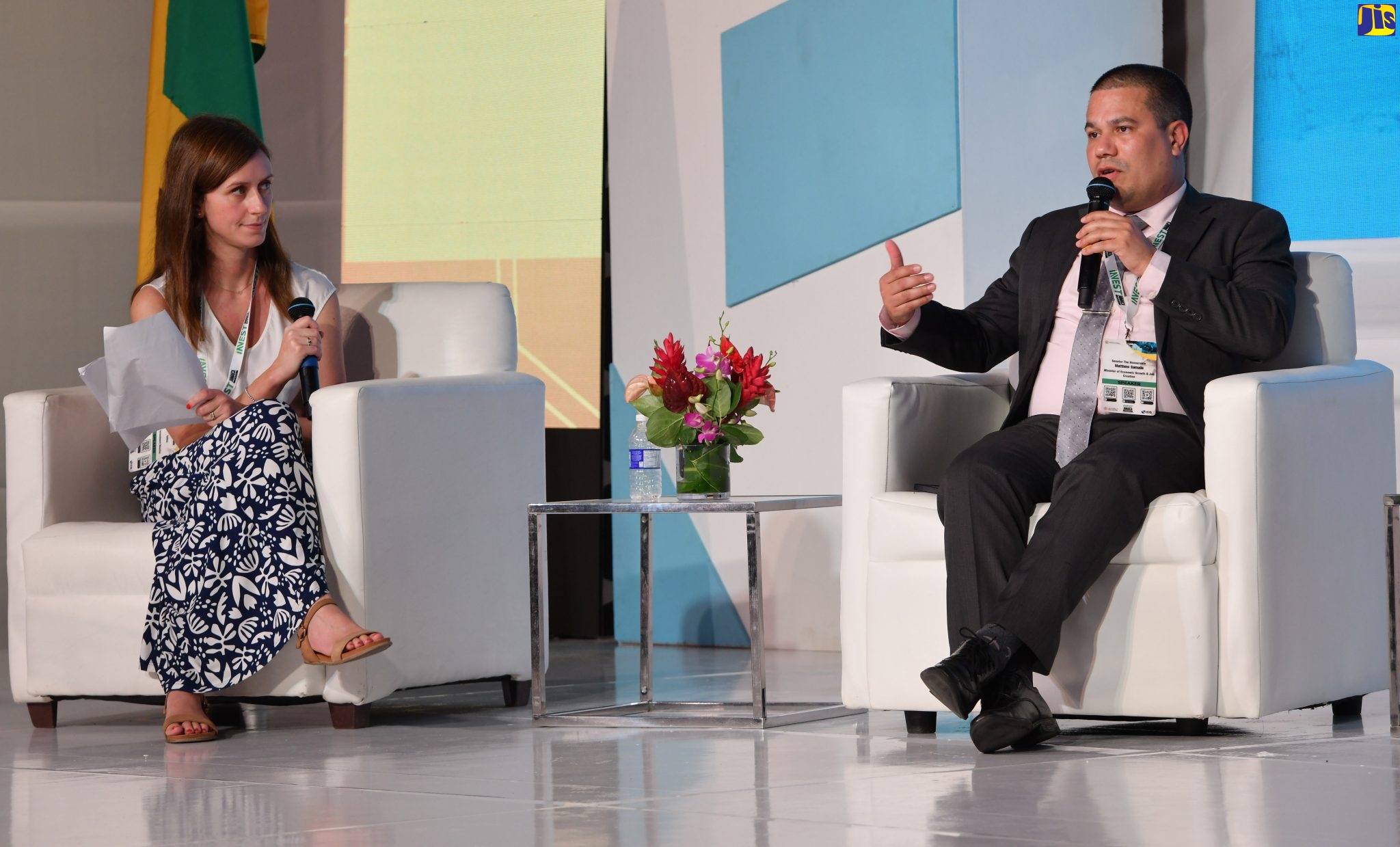 Minister without Portfolio in the Ministry of Economic Growth and Job Creation, Senator the Hon. Matthew Samuda (right), participates in a panel discussion at the Invest Jamaica 2022 Business Conference, being held at the Montego Bay Convention Centre in St. James, on November 29. At left is Moderator and Senior Editor at Investment Monitor, Viola Caon.